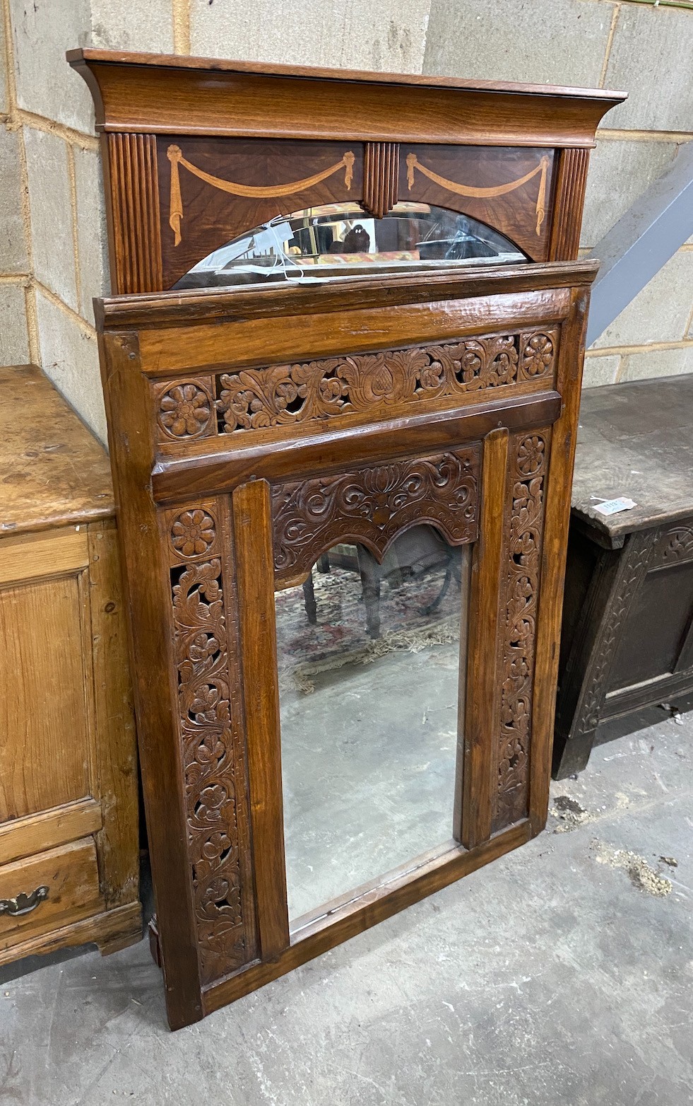 A Spanish inlaid walnut wall mirror, width 80cm height 128cm, and a later Asian carved and pierced wood wall mirror, width 79cm height 106cm                                                                                