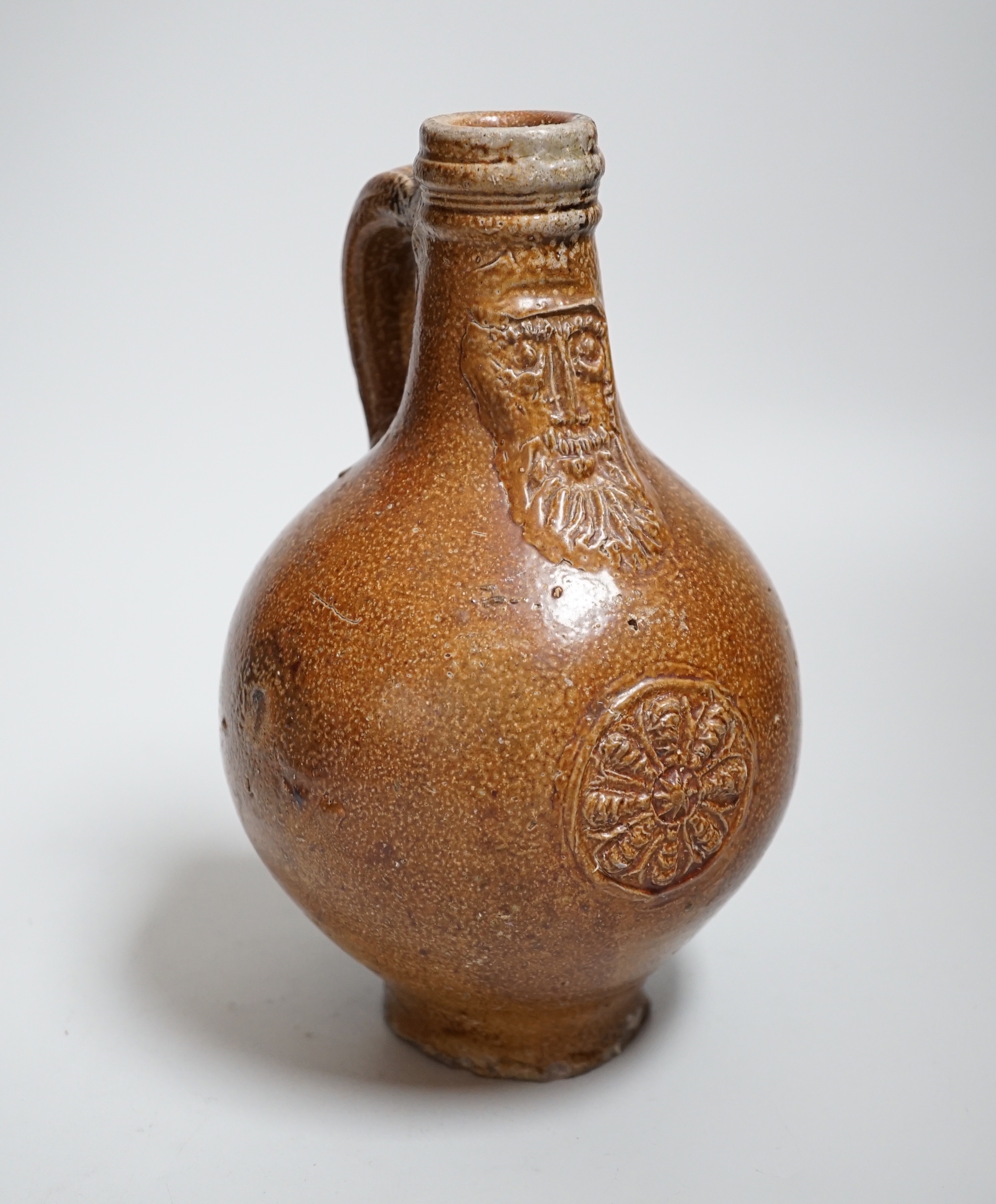 A 17th century stoneware Bellarmine or Bartmann jug, 21cm                                                                                                                                                                   