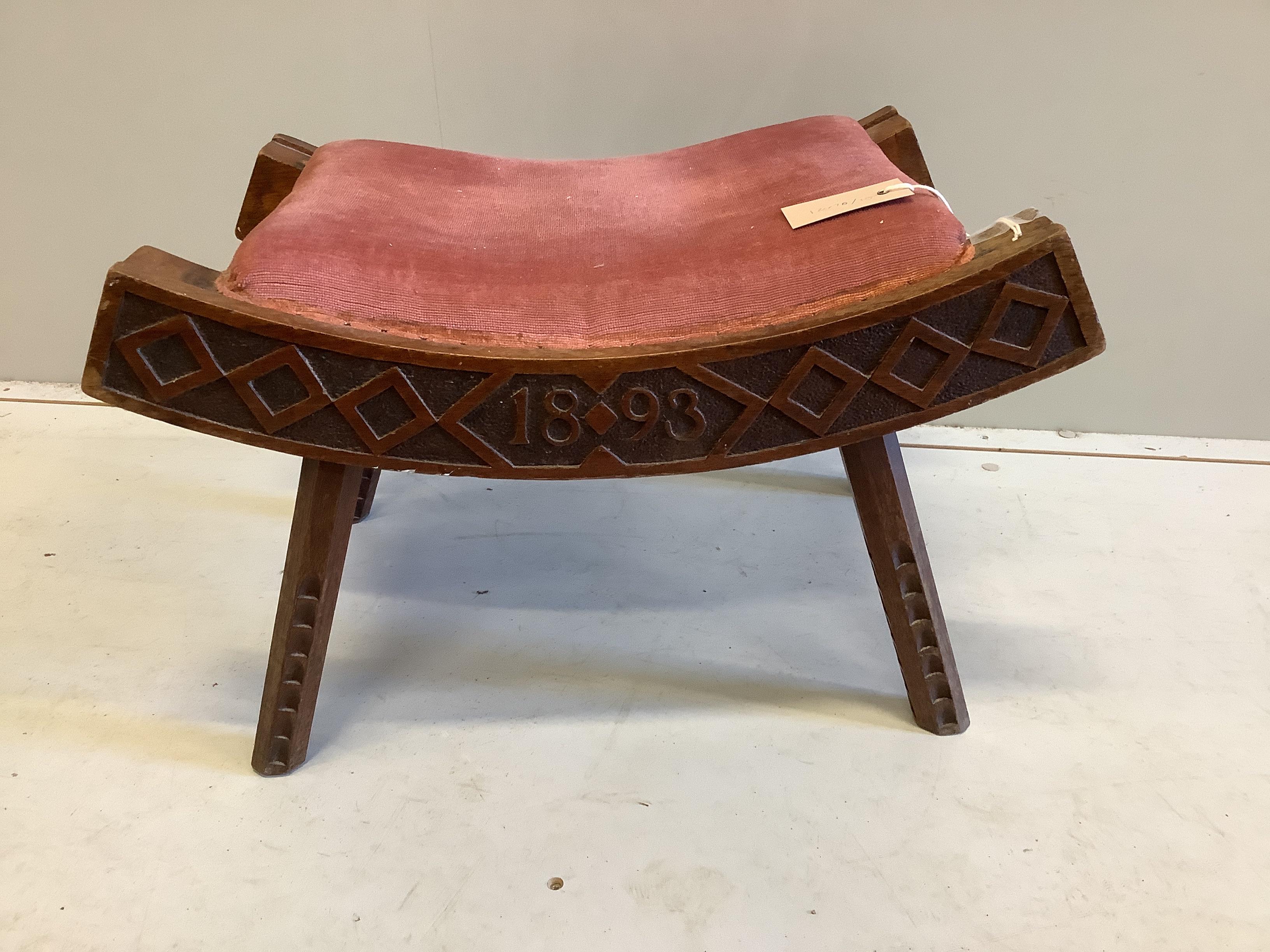 A Liberty chip carved stool, dated 1893, width 56cm, height 34cm                                                                                                                                                            