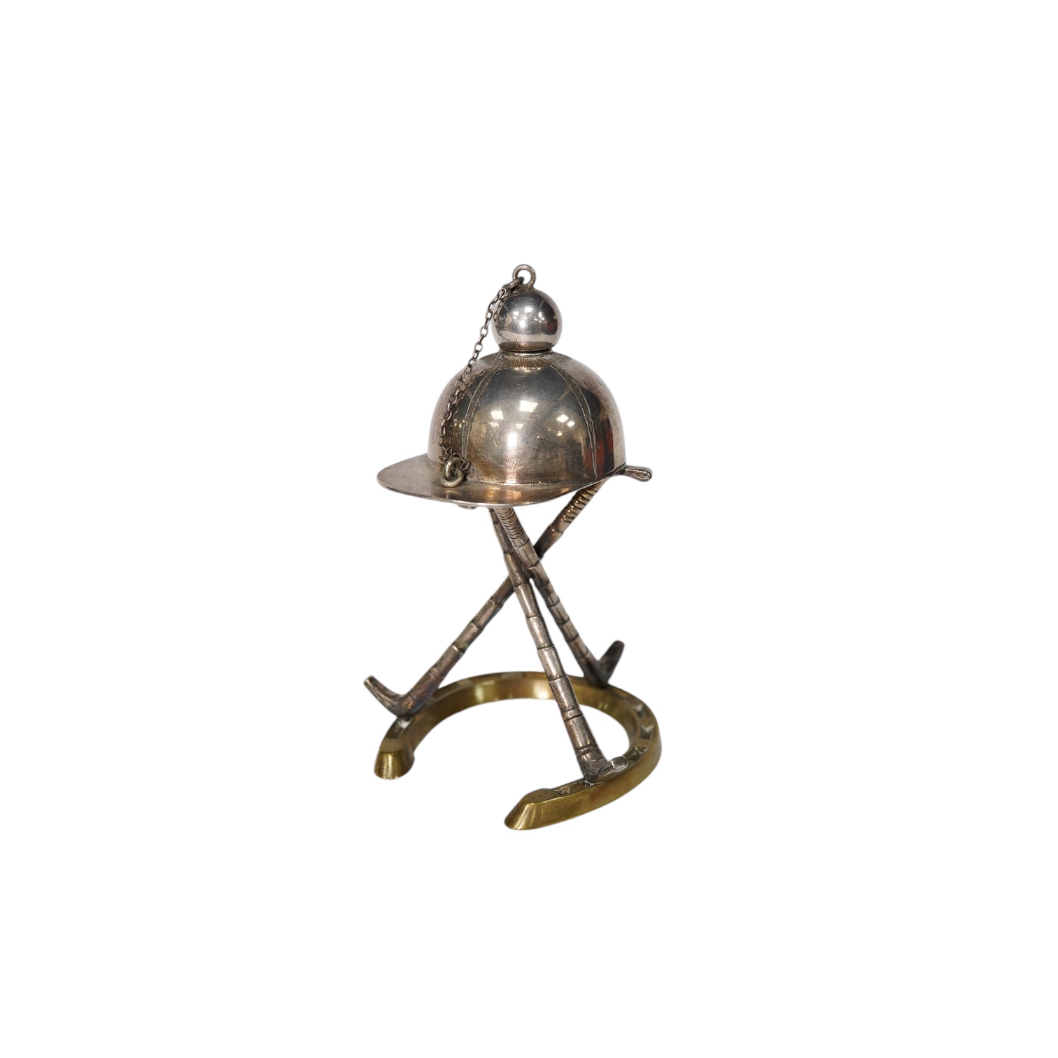 A late Victorian 'equestrian theme' silver plated novelty club lighter, modelled with a riding hat, crops and a horseshoe, 11.7cm. Condition - good                                                                         