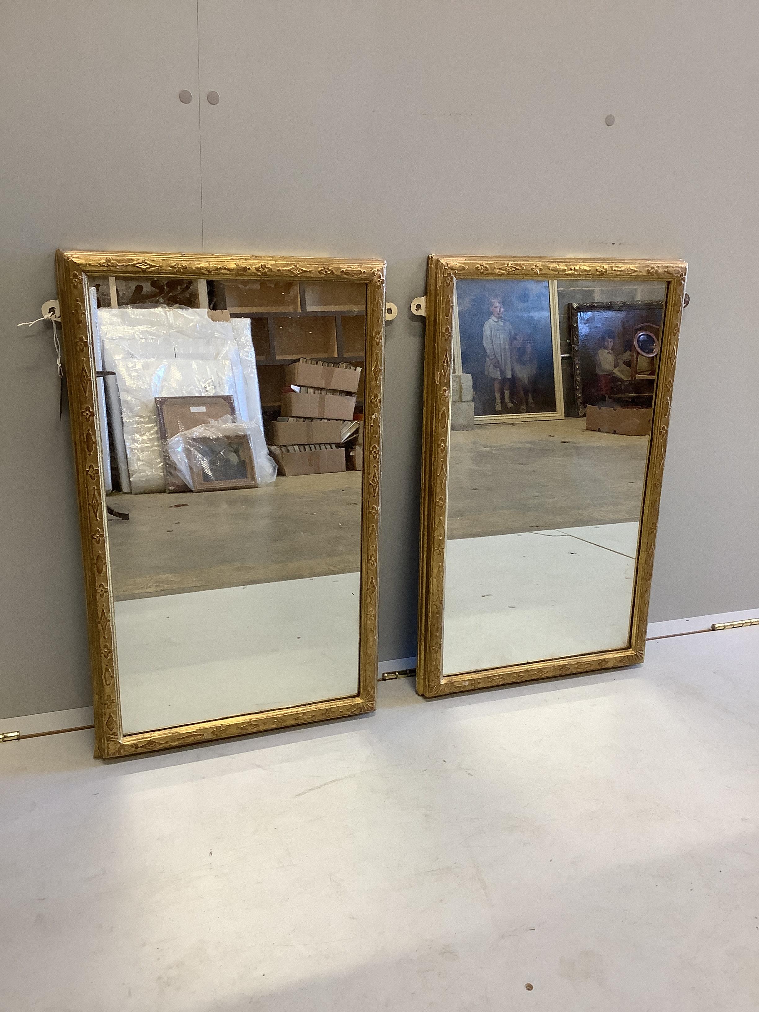 A pair of 19th century rectangular giltwood and composition wall mirrors, width 44cm, height 72cm                                                                                                                           