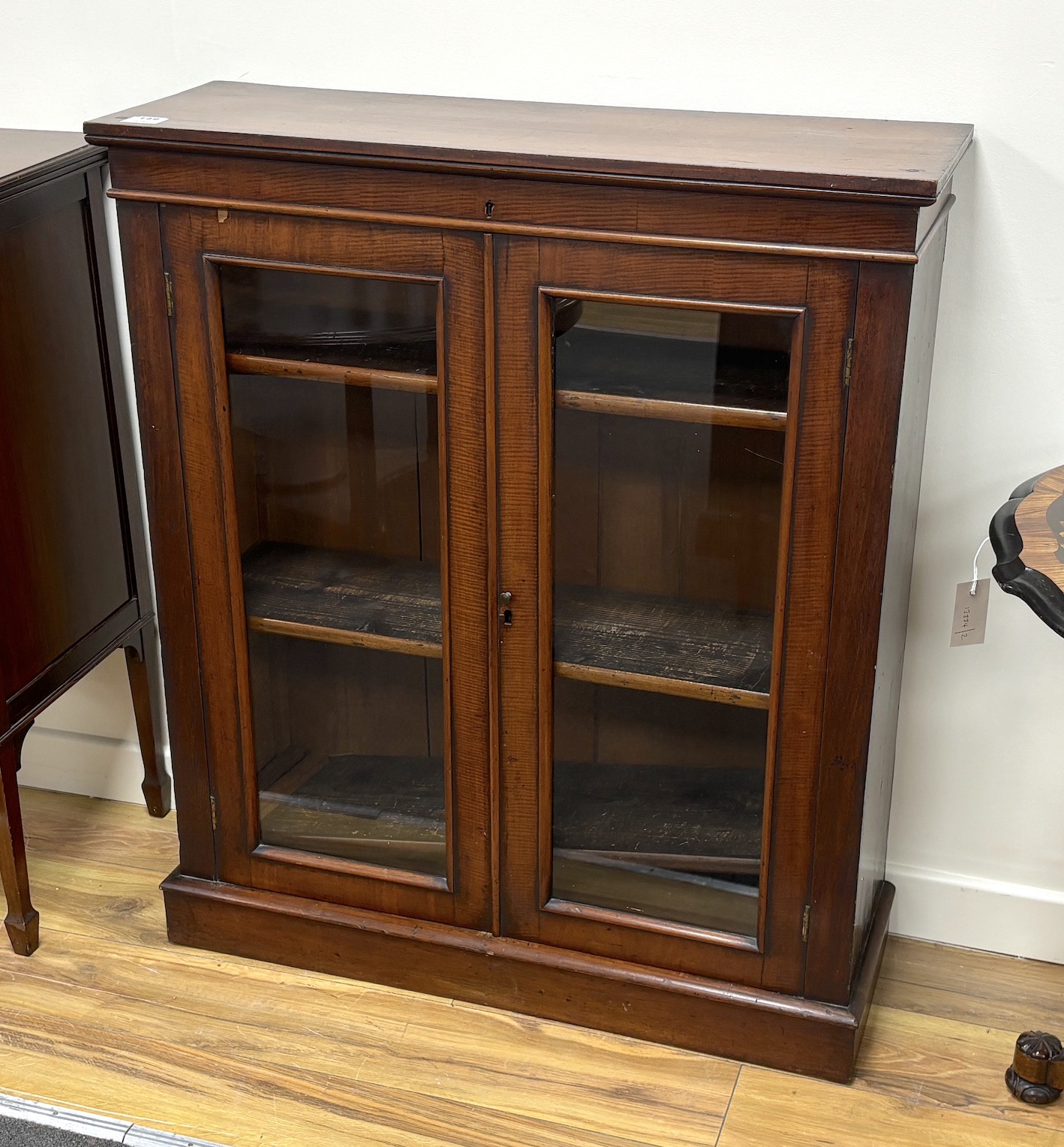 A late Victorian glazed mahogany bookcase, width 87cm, depth 29cm, height 102cm                                                                                                                                             