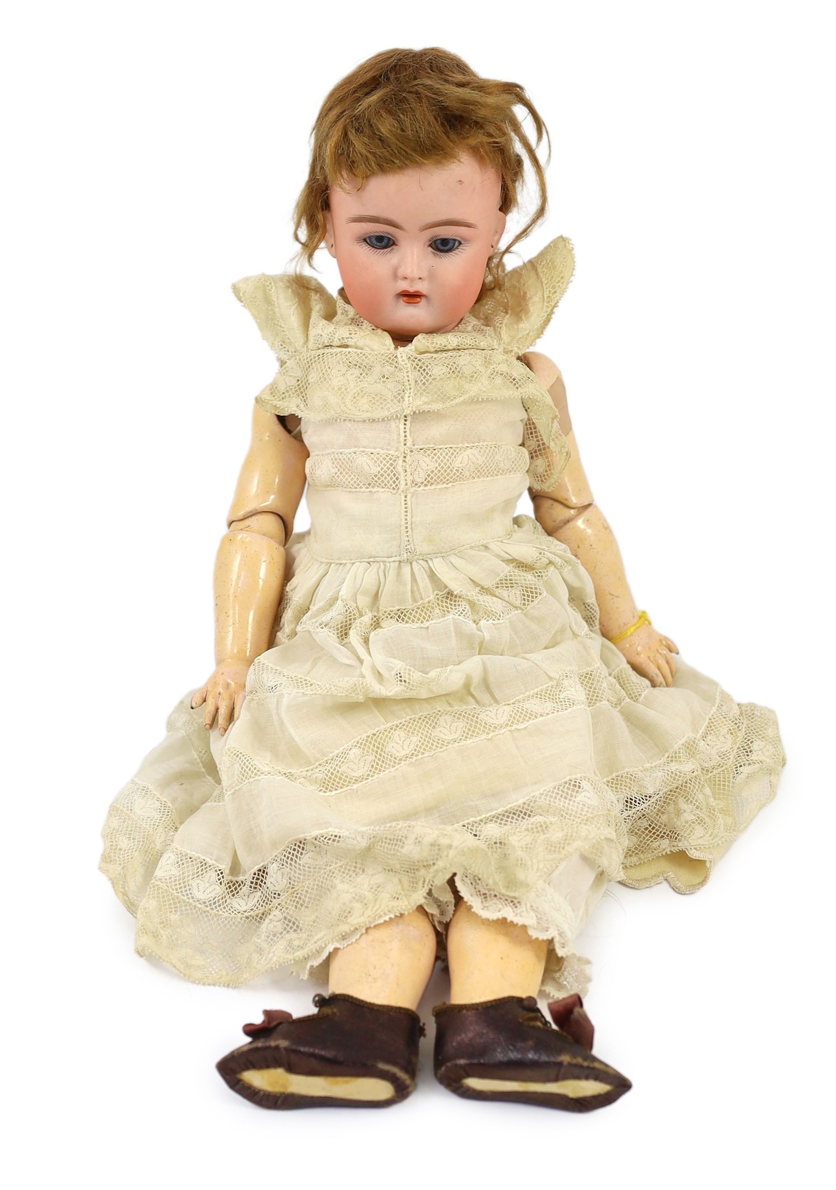 A bisque headed doll, probably by Kammer & Reinhardt, German, circa 1890, 16in.                                                                                                                                             