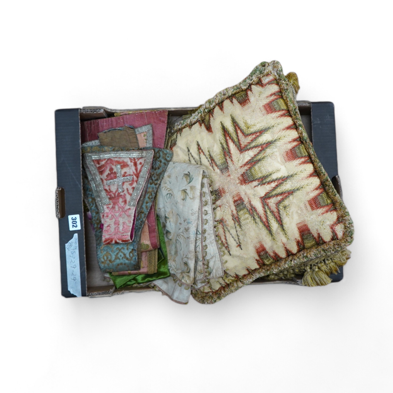 A collection of 18th and 19th century textiles, to include religious Maniples, two cushions, an embroidered chain stitch table cover with intricate edging, a Chinese embroidered panel and floral painted satin. Condition 