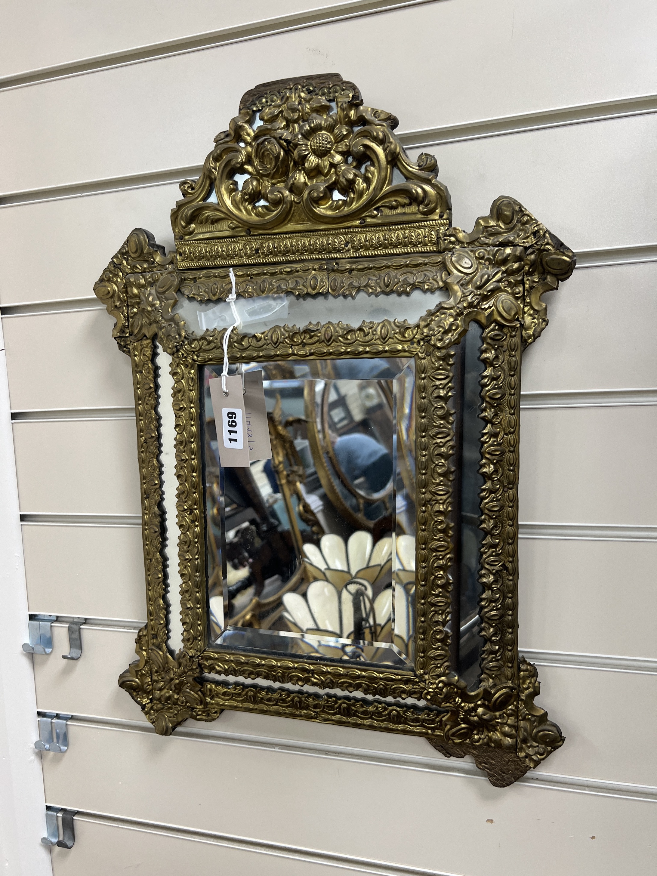 A 19th century French embossed brass wall mirror, width 39cm, height 54cm                                                                                                                                                   