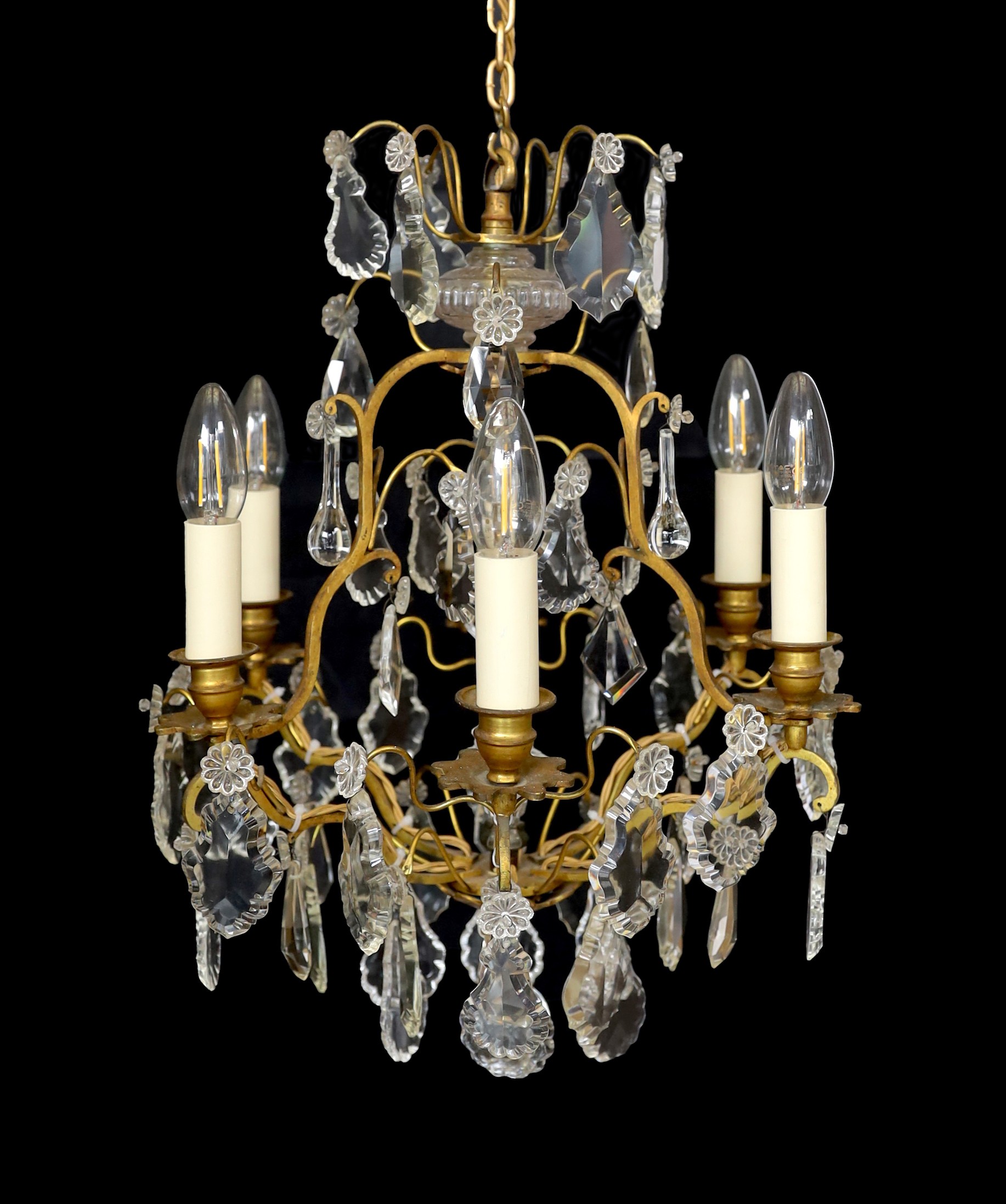 An early 20th century French gilt bronze and cut glass six light chandelier, height 54cm. width 40cm                                                                                                                        