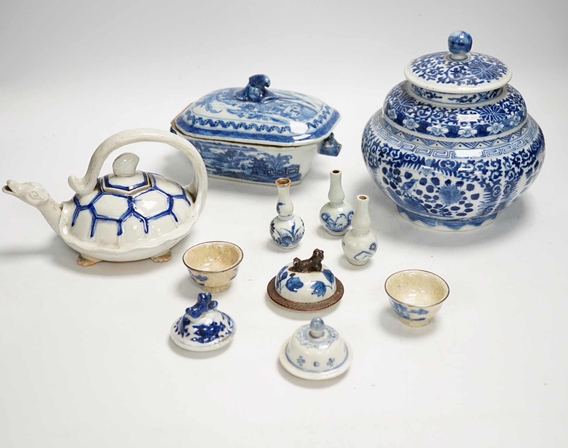 A Japanese Hirado ‘turtle’ teapot, an 18th century Chinese blue and white tureen and cover, an early 20th century jar and cover, teapot and various small vases, covers etc.                                                