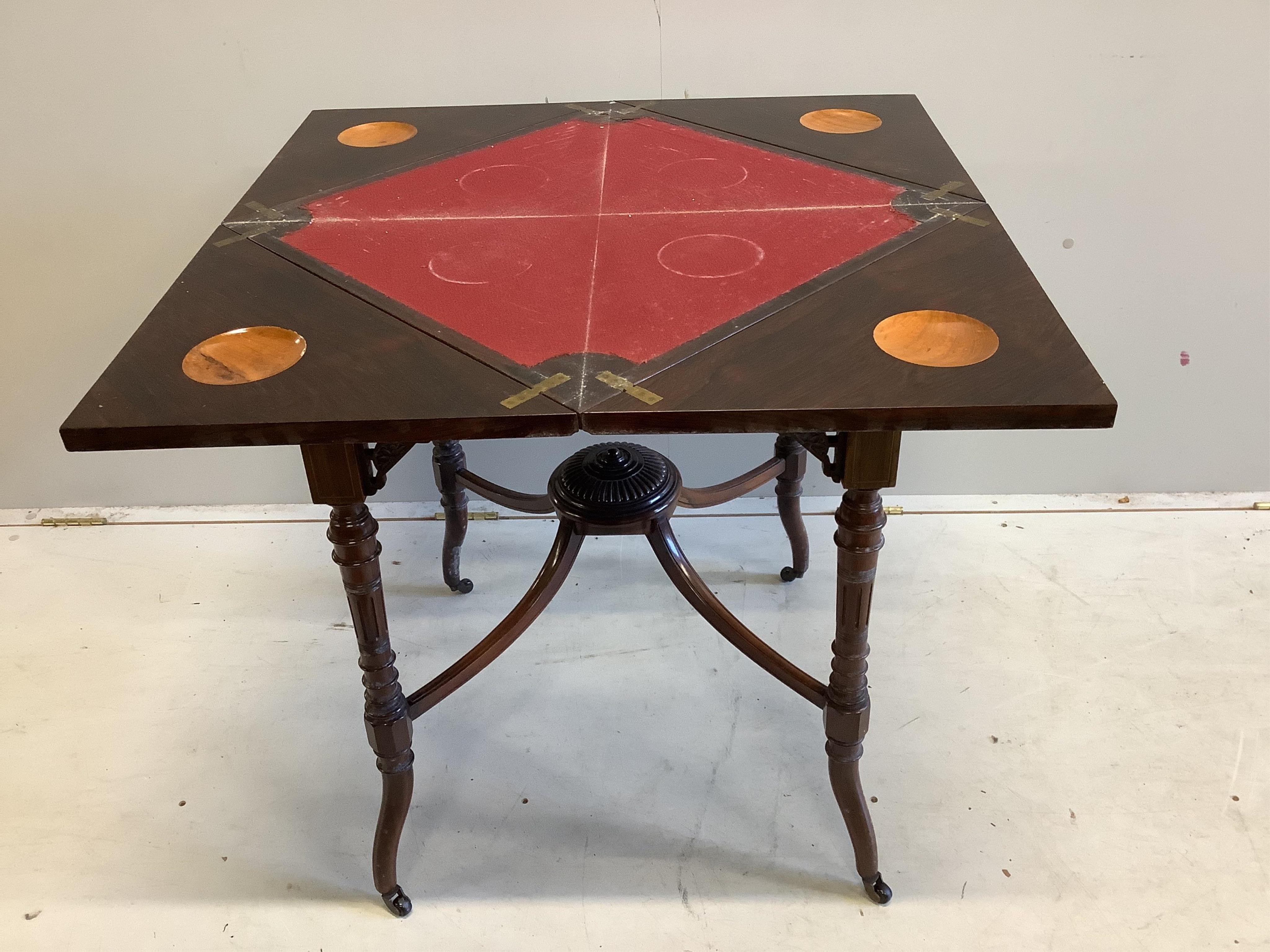 An Edwardian inlaid rosewood envelope card table, width 54cm, depth 54cm, height 74cm. Condition - fair                                                                                                                     