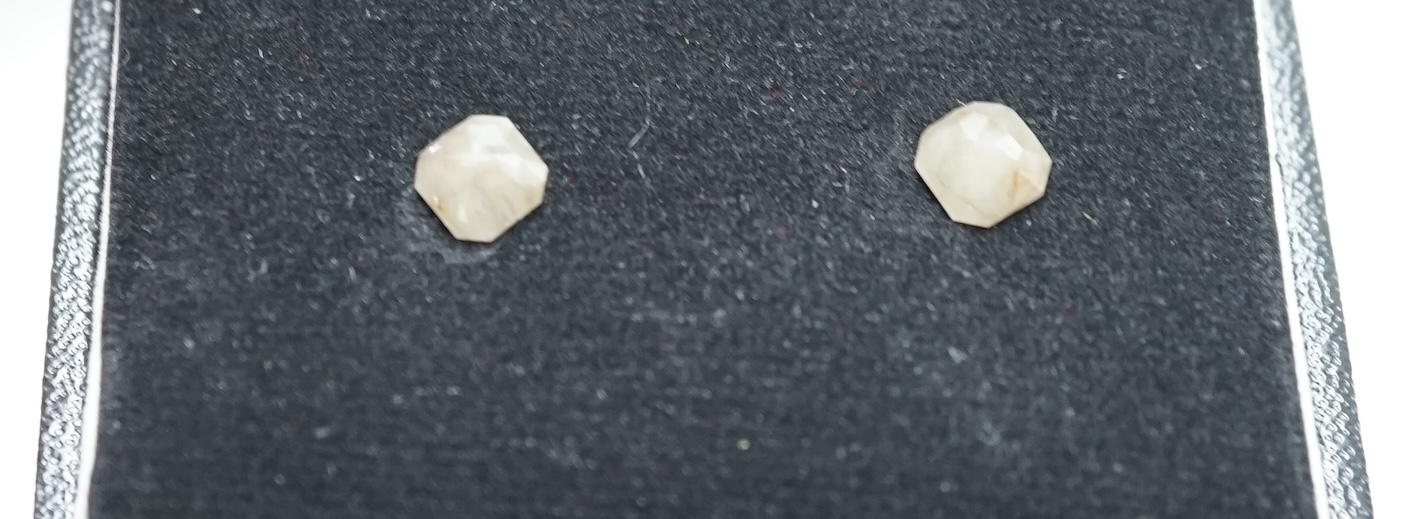 A pair of unmounted cut diamonds, with a total approximate weight of 2.72ct. Condition - poor to fair                                                                                                                       