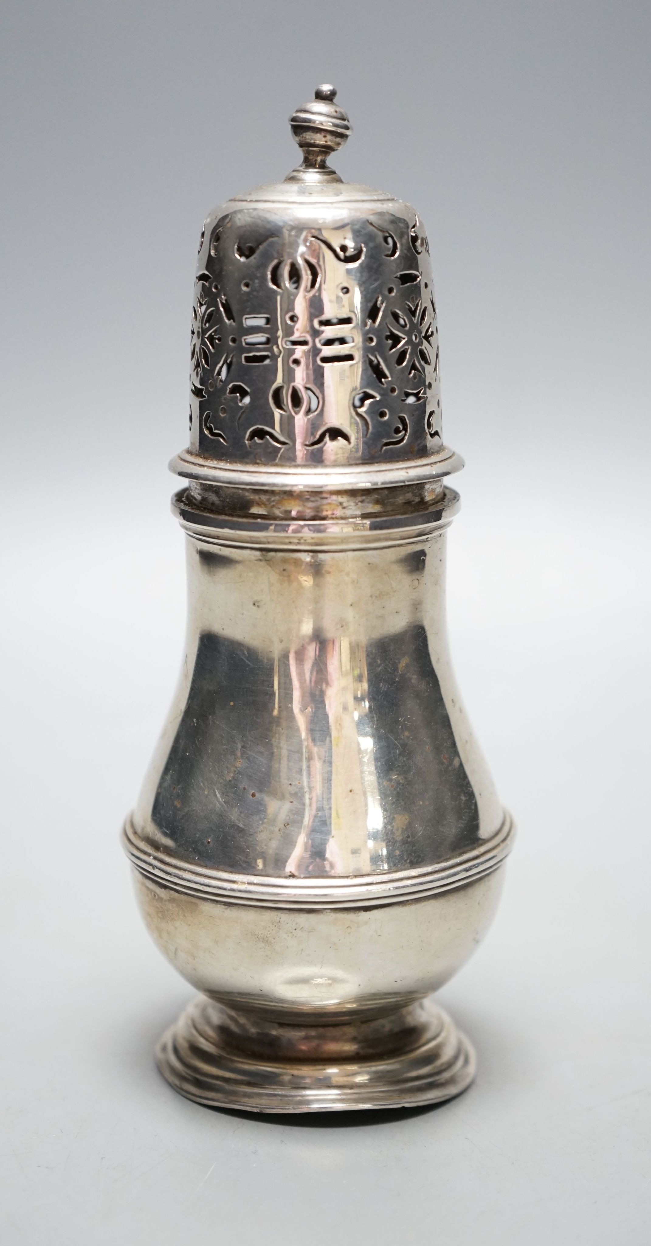 A George VI Brittania standard silver sugar caster, by Asprey & Co, London, 1937, 15.5cm, 179 grams.                                                                                                                        