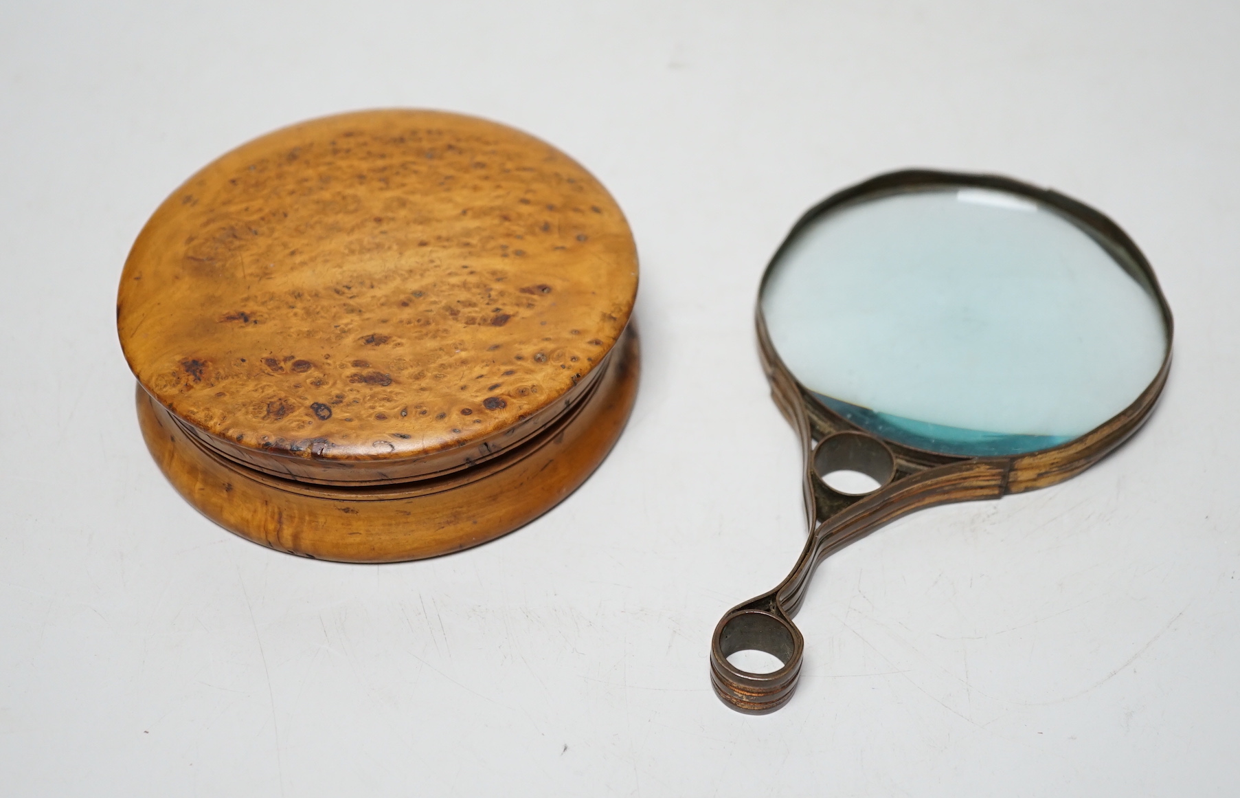 A 19th century burr walnut snuff box, 10.7cm and a gilt brass magnifying glass                                                                                                                                              