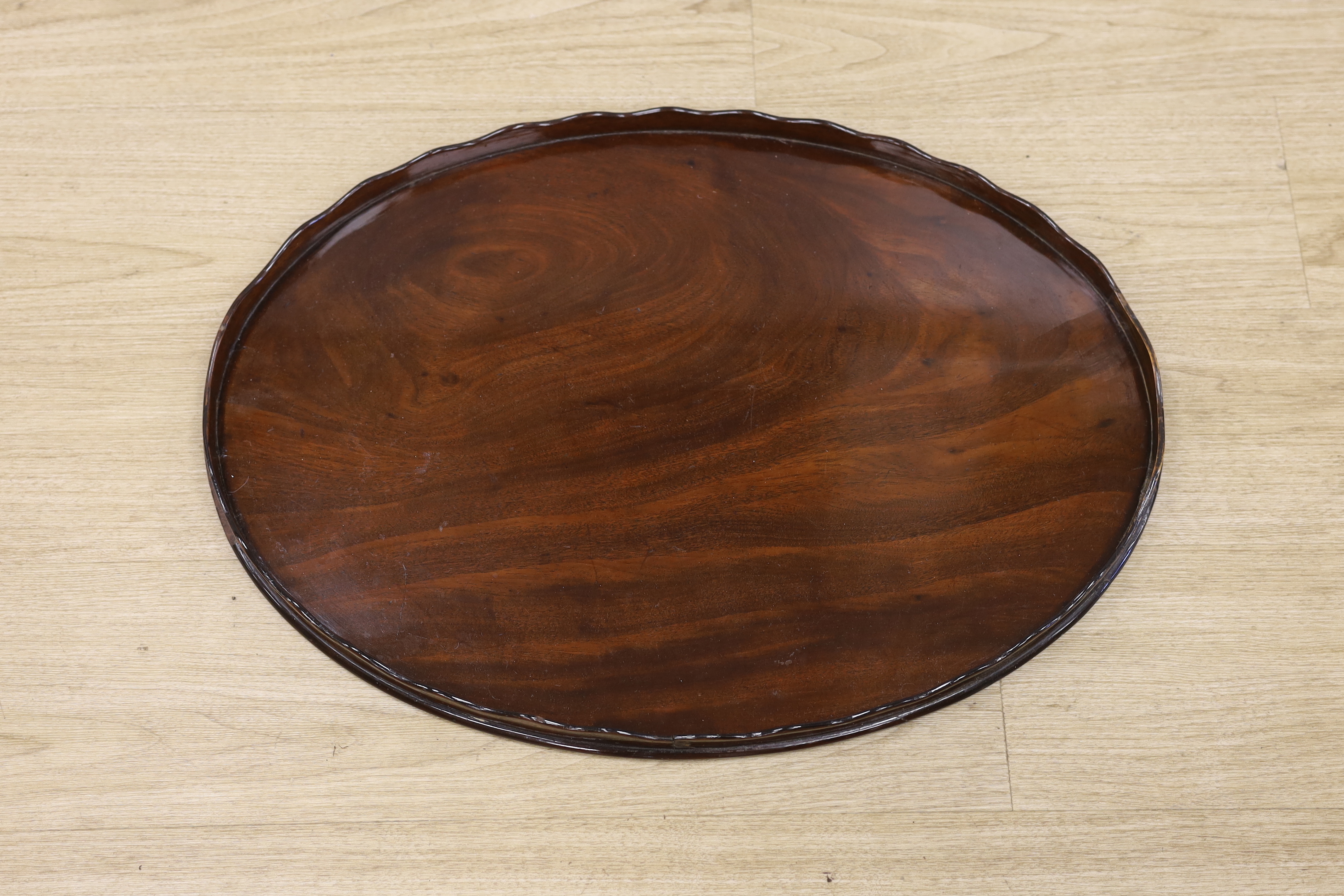 A George III mahogany oval galleried tray, 65cm wide                                                                                                                                                                        