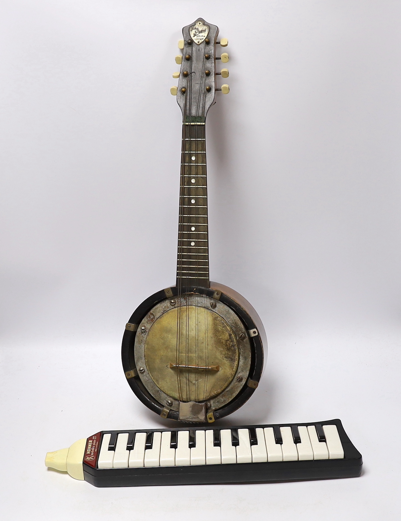 A John Grey and sons, London eight string banjolele in original case and a Hohner melodica                                                                                                                                  