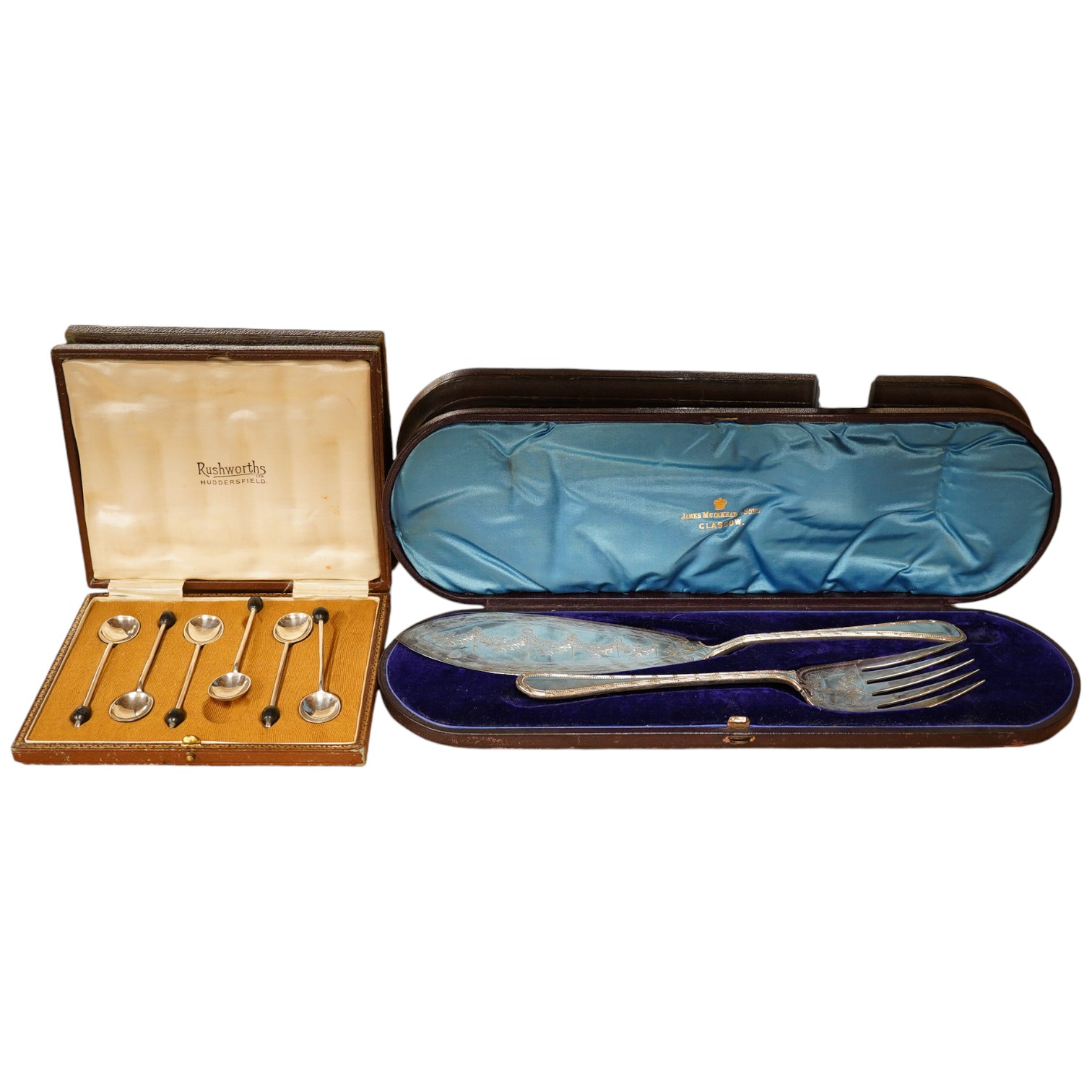 A cased set of six George V silver bean end coffee spoons and a cased pair of silver plated fish servers. Condition - fair                                                                                                  