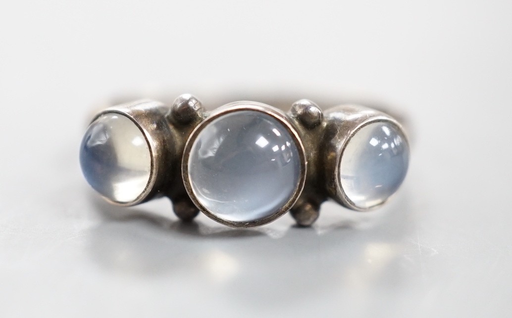 A Georg Jensen sterling 925 and three stone cabochon moonstone set half hoop ring, no. 3, size M/N, in Georg Jensen box.                                                                                                    
