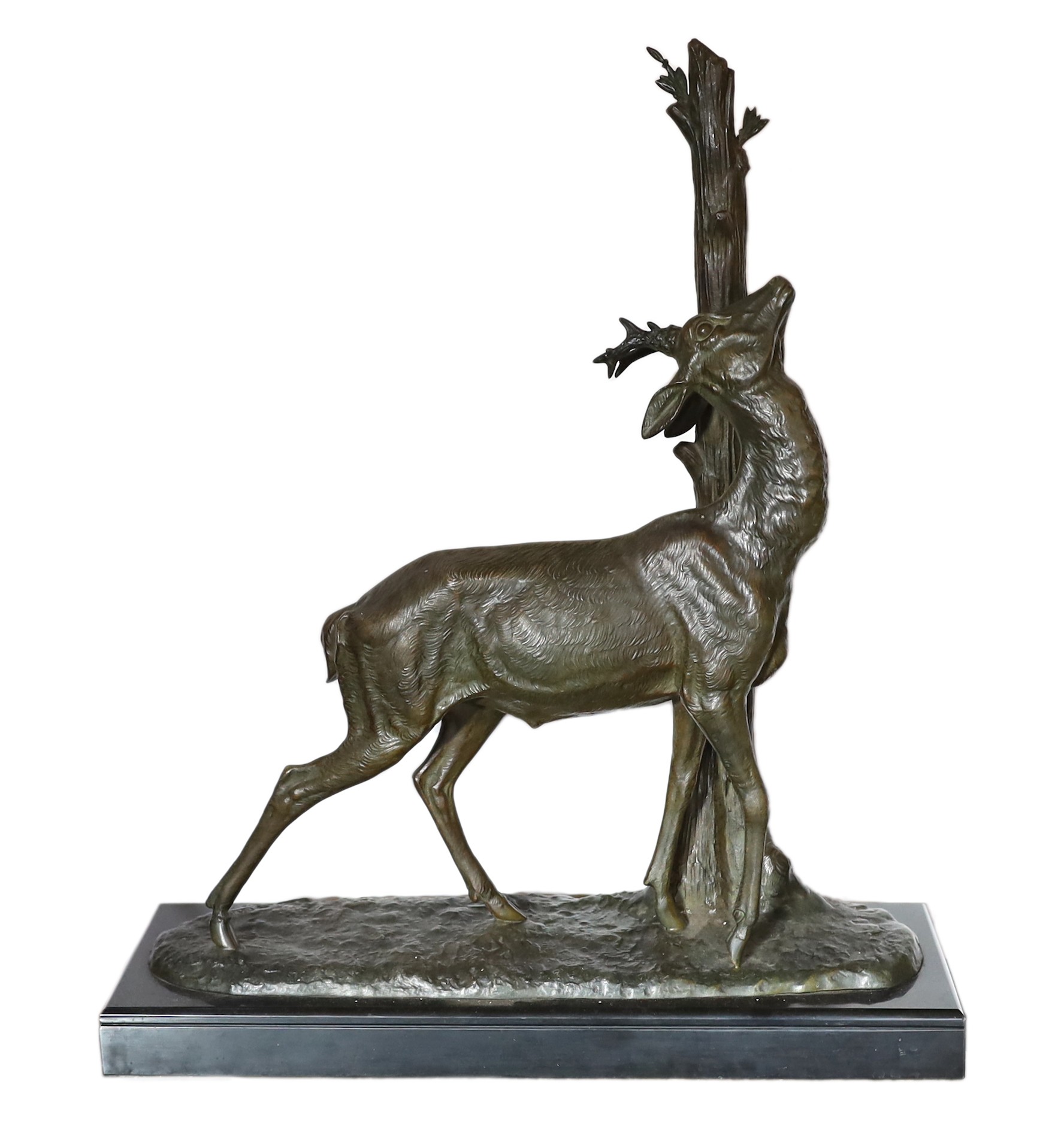 A 1930s French bronzed spelter and marble model of a deer standing beside a tree trunk, signed Cham, height 60cm. width 49cm                                                                                                