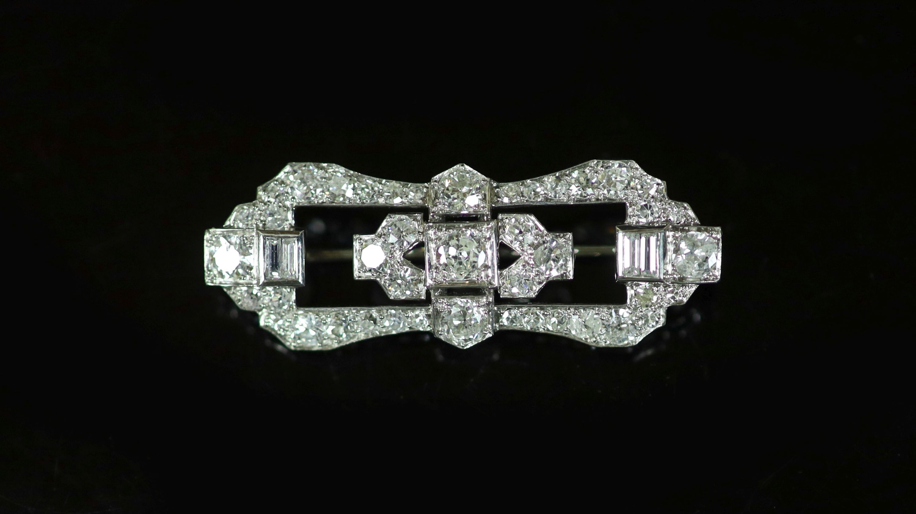A 1940's/1950's platinum and diamond cluster set open work brooch                                                                                                                                                           