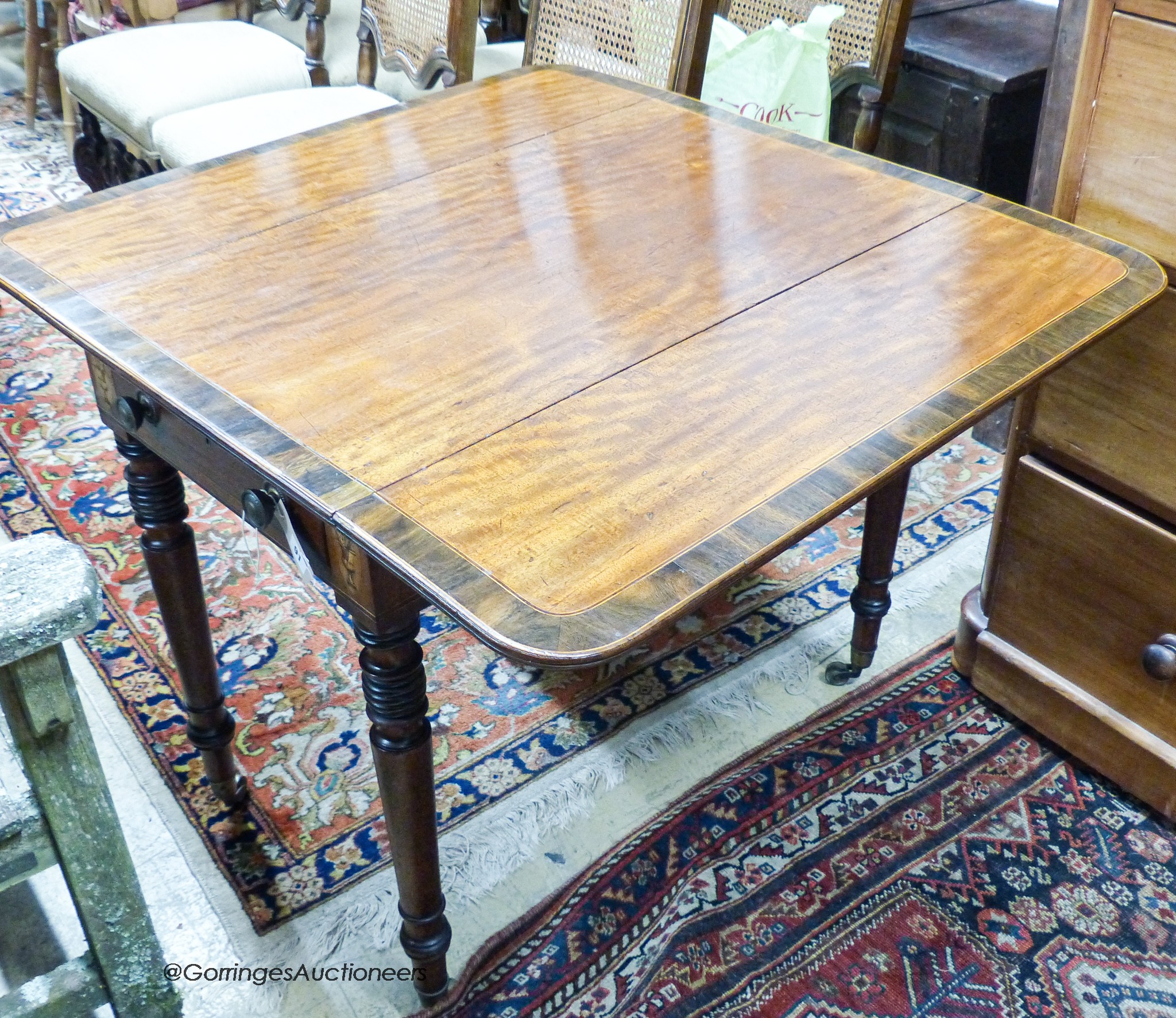 A George IV rosewood banded mahogany Pembroke table, width 90cm, depth 50cm, height 72cm                                                                                                                                    