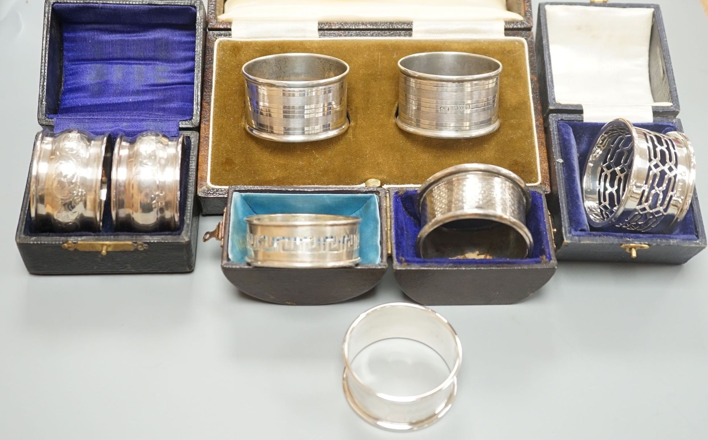 A cased pair of George V silver napkin rings by Charles Horner, Chester, 1924, one other cased pair of silver napkin rings and four assorted cased single silver napkin rings.                                              