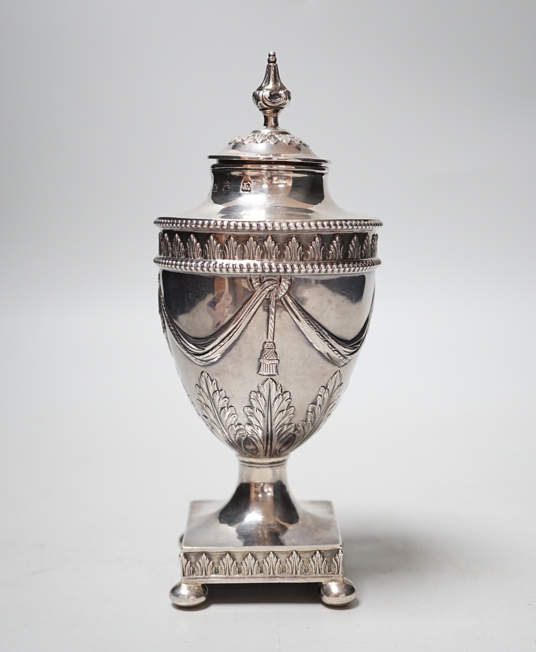 A George III silver vase and cover, with swag and fern decoration, on square base, with ball feet, Richard Morton & Co, Sheffield, 1775, 18cm, 8.7oz.                                                                       