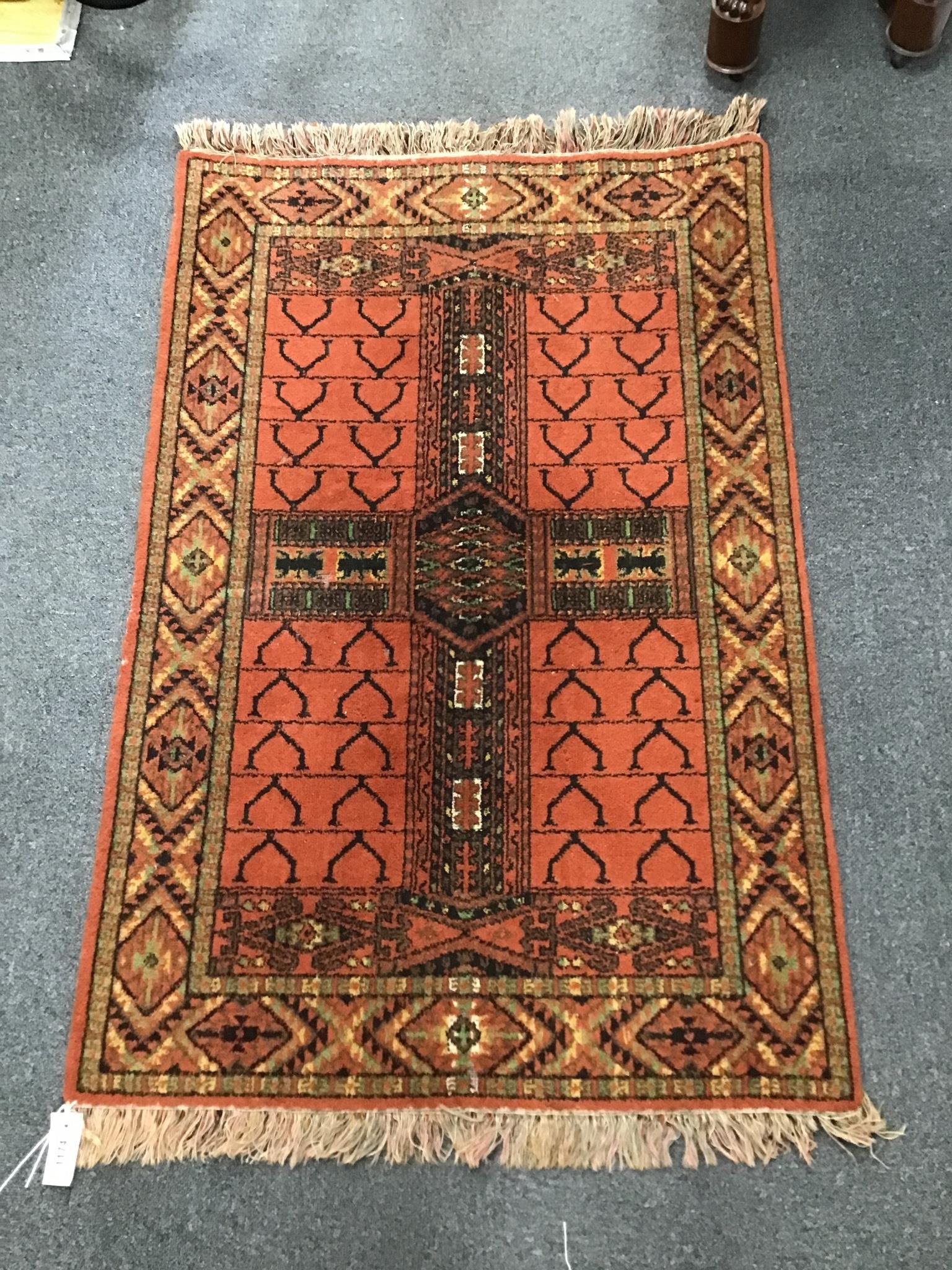 A Belouch style red ground rug, 130cm x 84cm                                                                                                                                                                                
