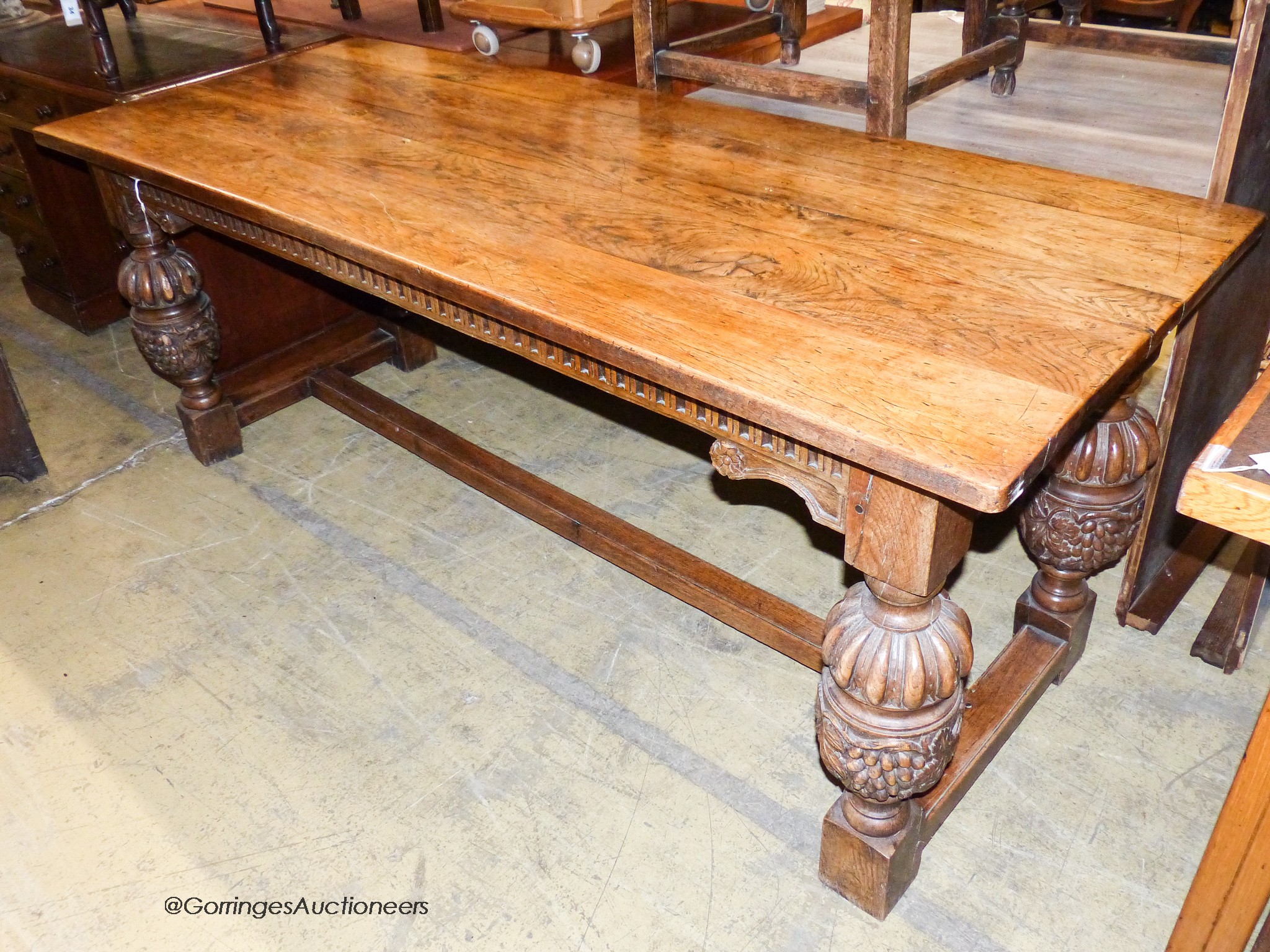 An Elizabethan style rectangular oak refectory dining table, width 198cm, depth 77cm, height 78cm                                                                                                                           