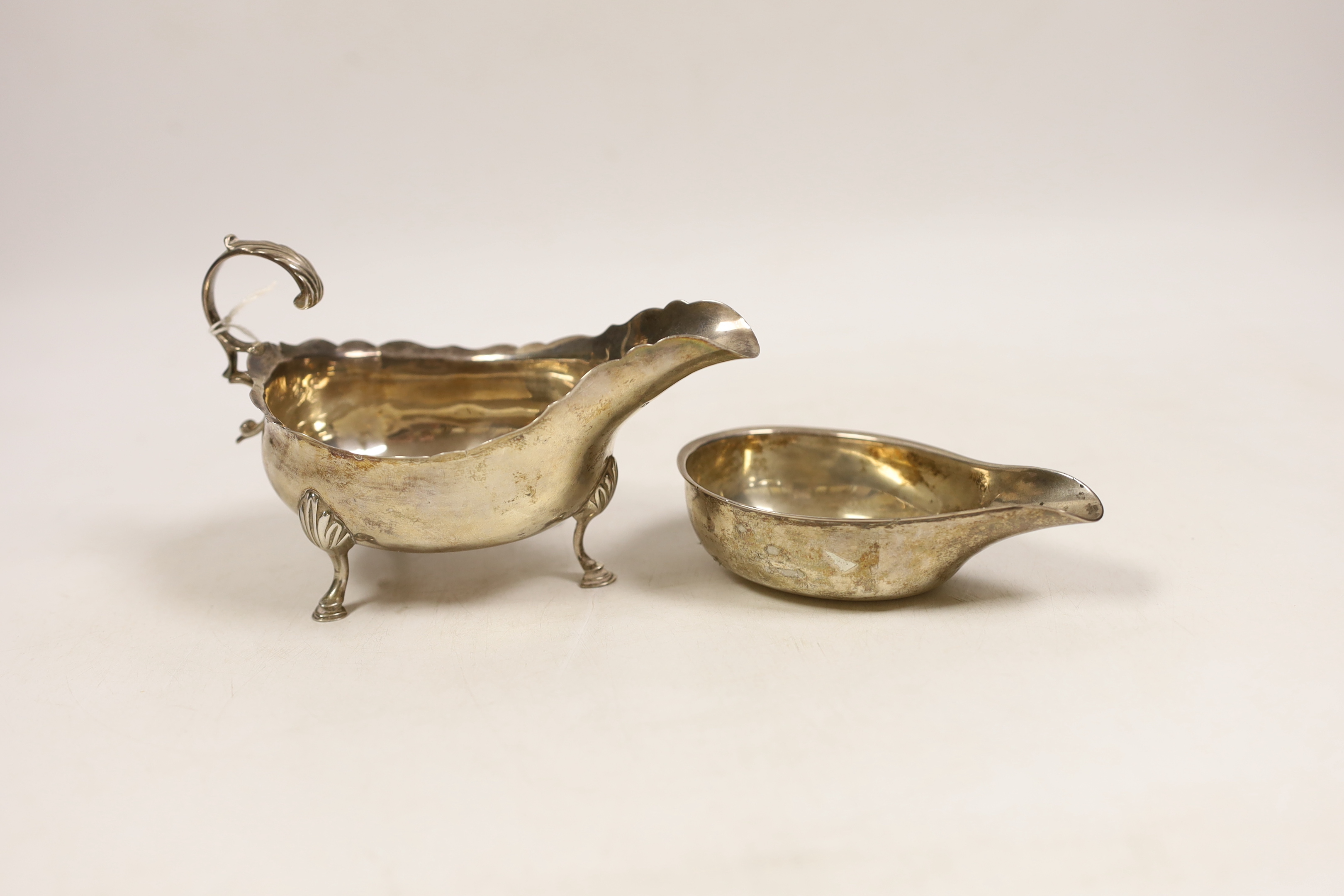 A George III silver sauceboat, by Peter, Ann & William Bateman, London, 1802, length 14.5cm (splits) and a George III silver pap boat, London, 1791.                                                                        