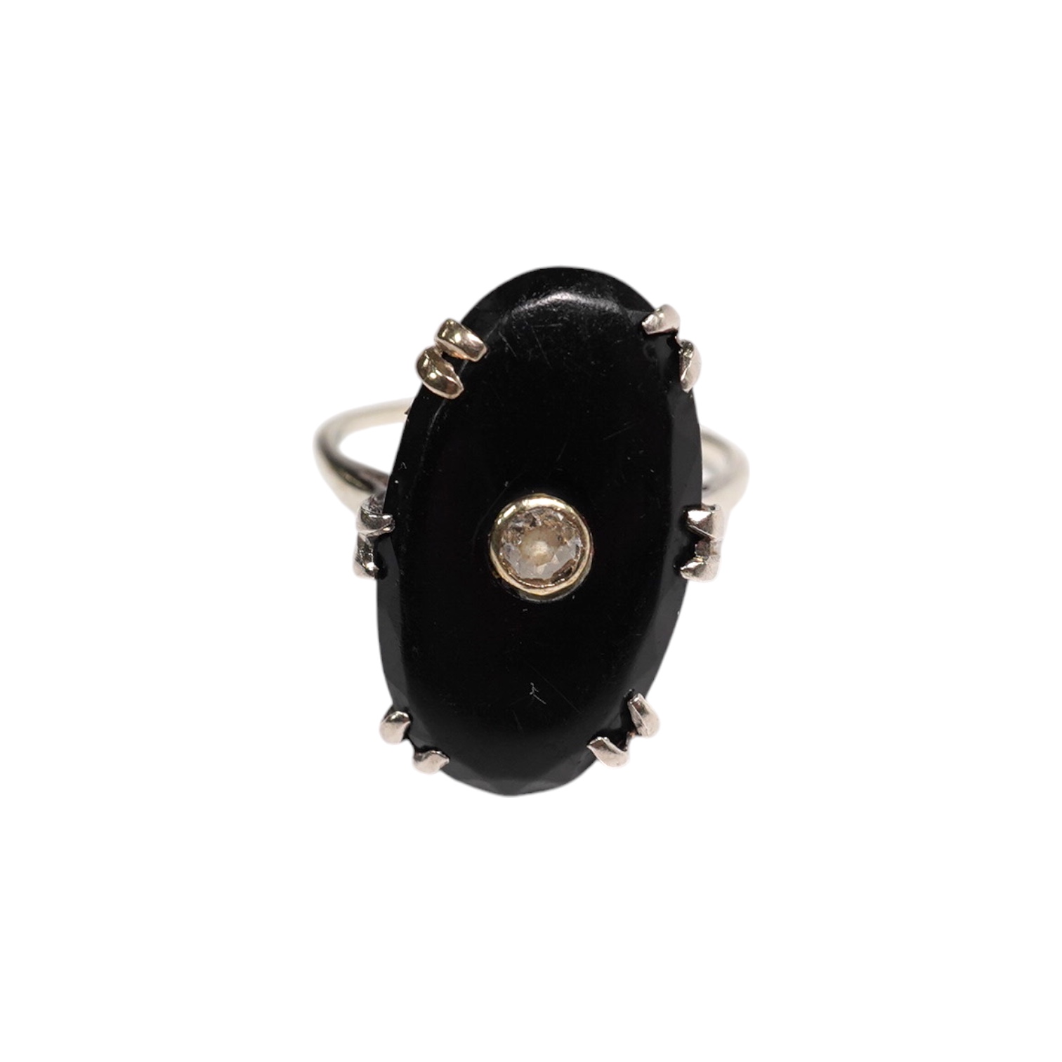 A white metal, black onyx and single stone diamond set oval ring, size M/N, gross weight 3.9 grams. Condition - poor to fair                                                                                                