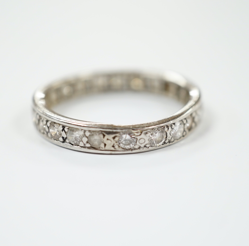 A white metal and diamond set full eternity ring, size U, gross weight 5 grams.                                                                                                                                             