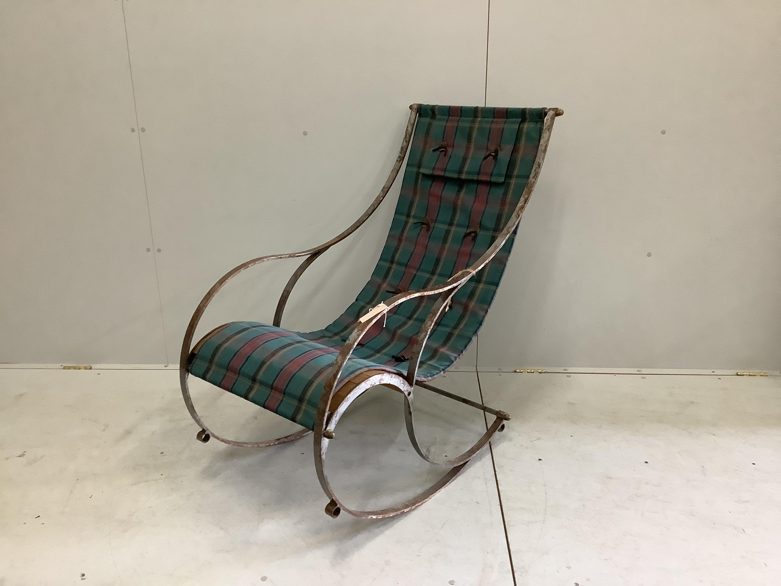 A vintage wrought steel rocking chair, width 56cm, depth 90cm, height 104cm                                                                                                                                                 