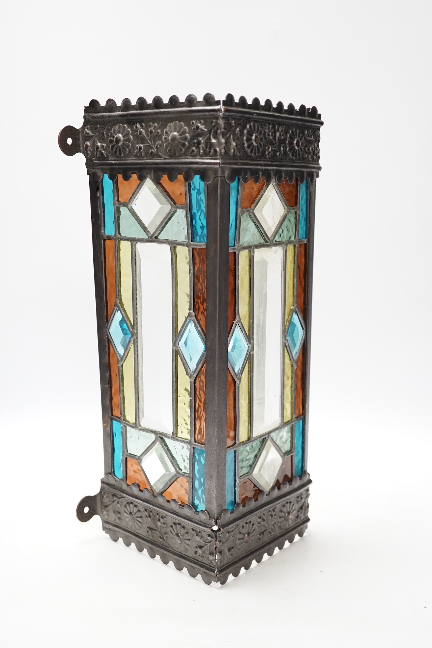 A stained glass three sided wall light, 38cm high                                                                                                                                                                           