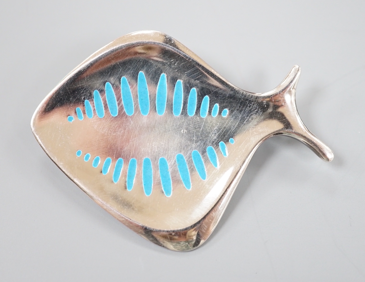 A Georg Jensen sterling and blue enamel stylised fish brooch, no. 343, 55mm.                                                                                                                                                