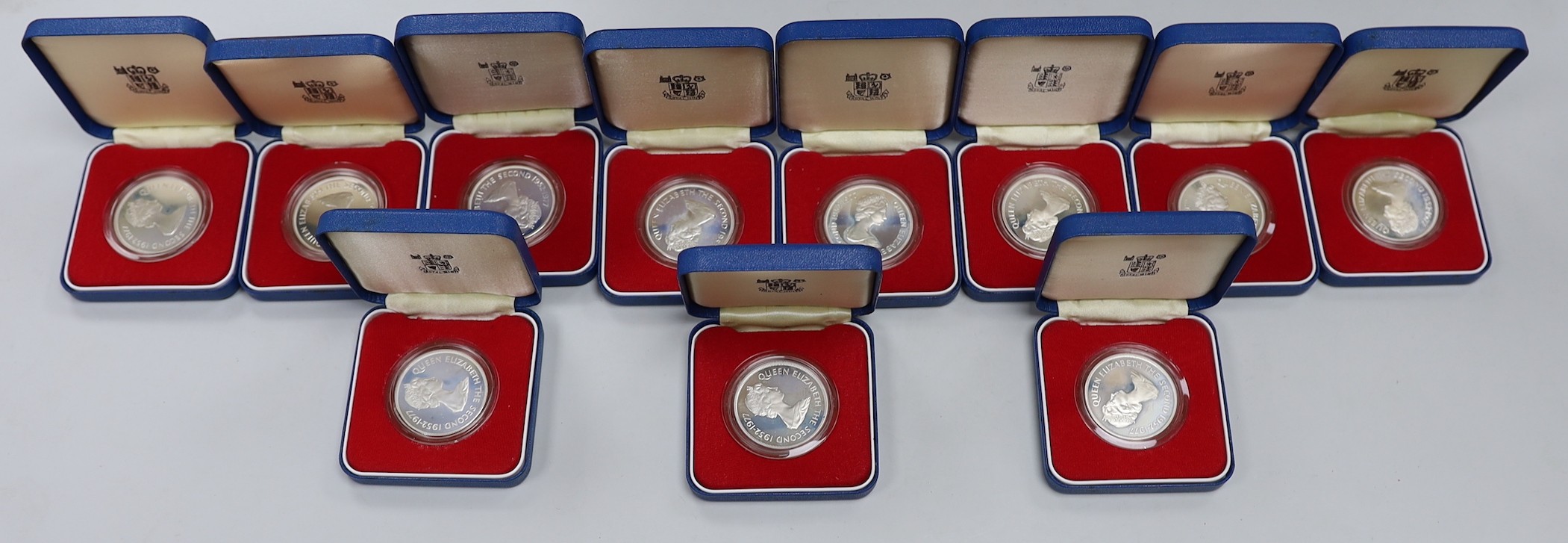 Eleven Royal Mint Commonwealth commemorative proof silver crowns                                                                                                                                                            