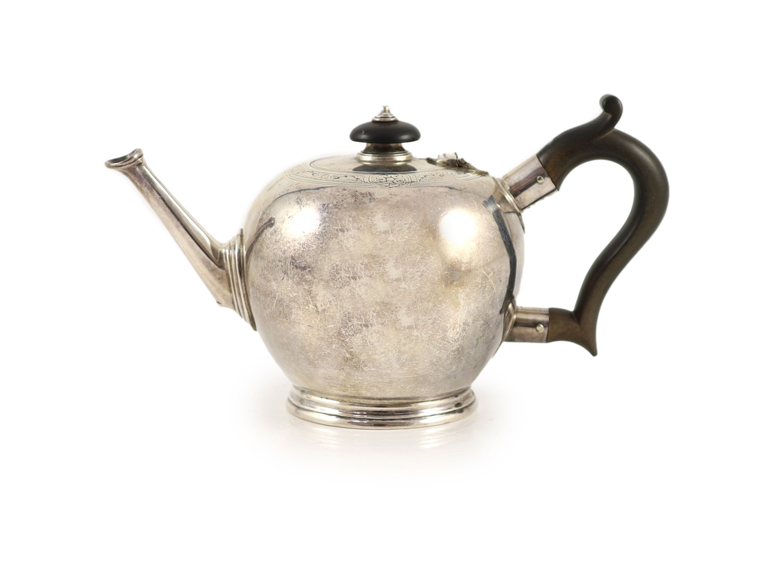 A George II engraved silver bullet shaped teapot, London, 1751                                                                                                                                                              