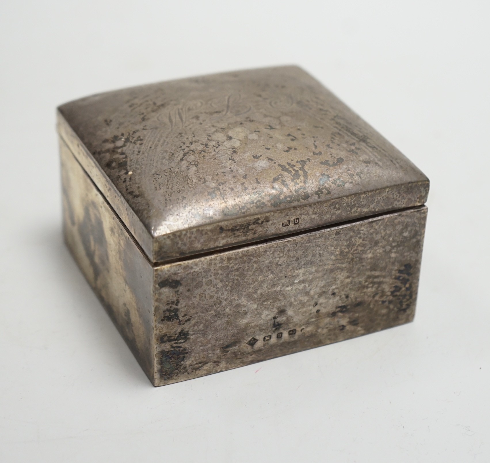 A late Victorian silver mounted square cigarette box, Mappin Bros, Birmingham, 1895, 89mm.                                                                                                                                  