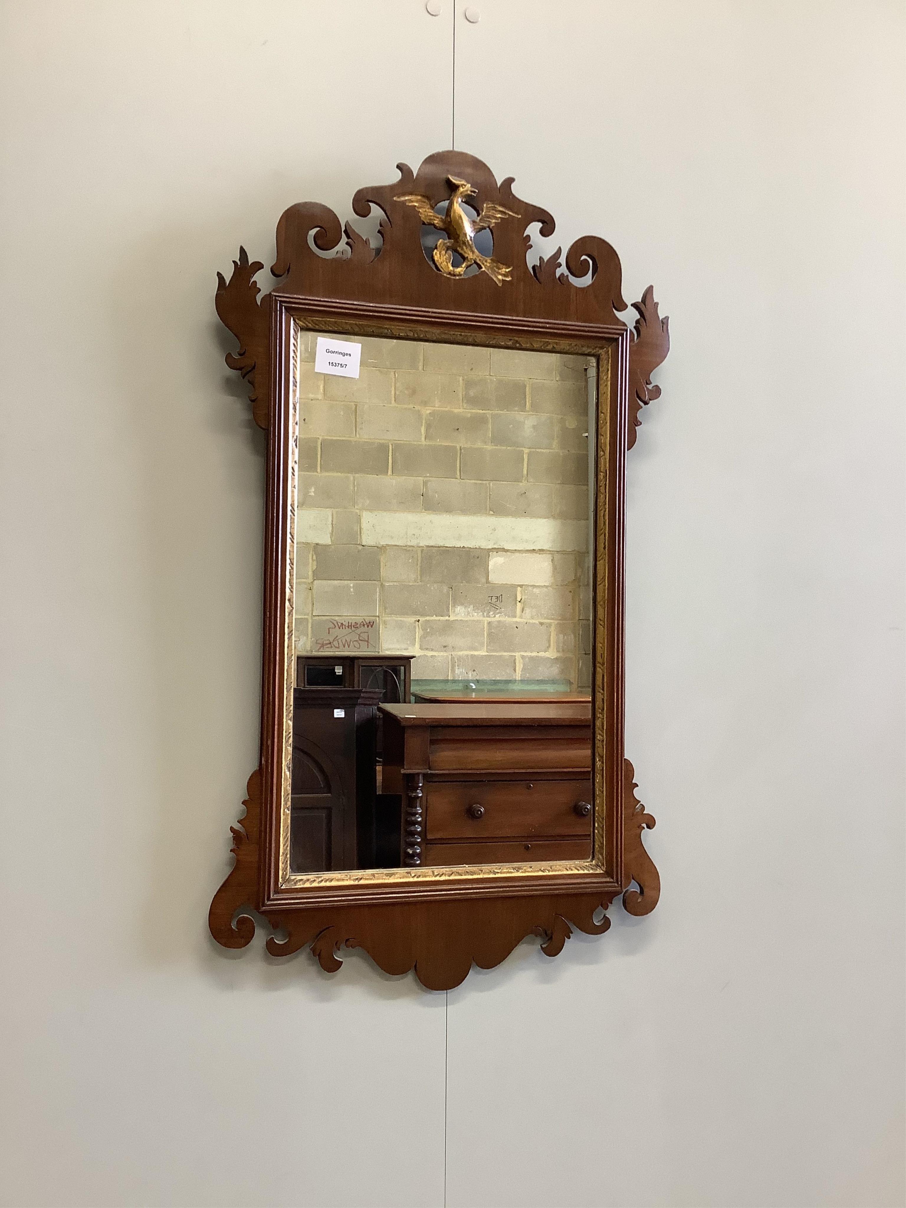 A George III mahogany fret cut wall mirror, width 43cm, height 78cm. Condition - good                                                                                                                                       