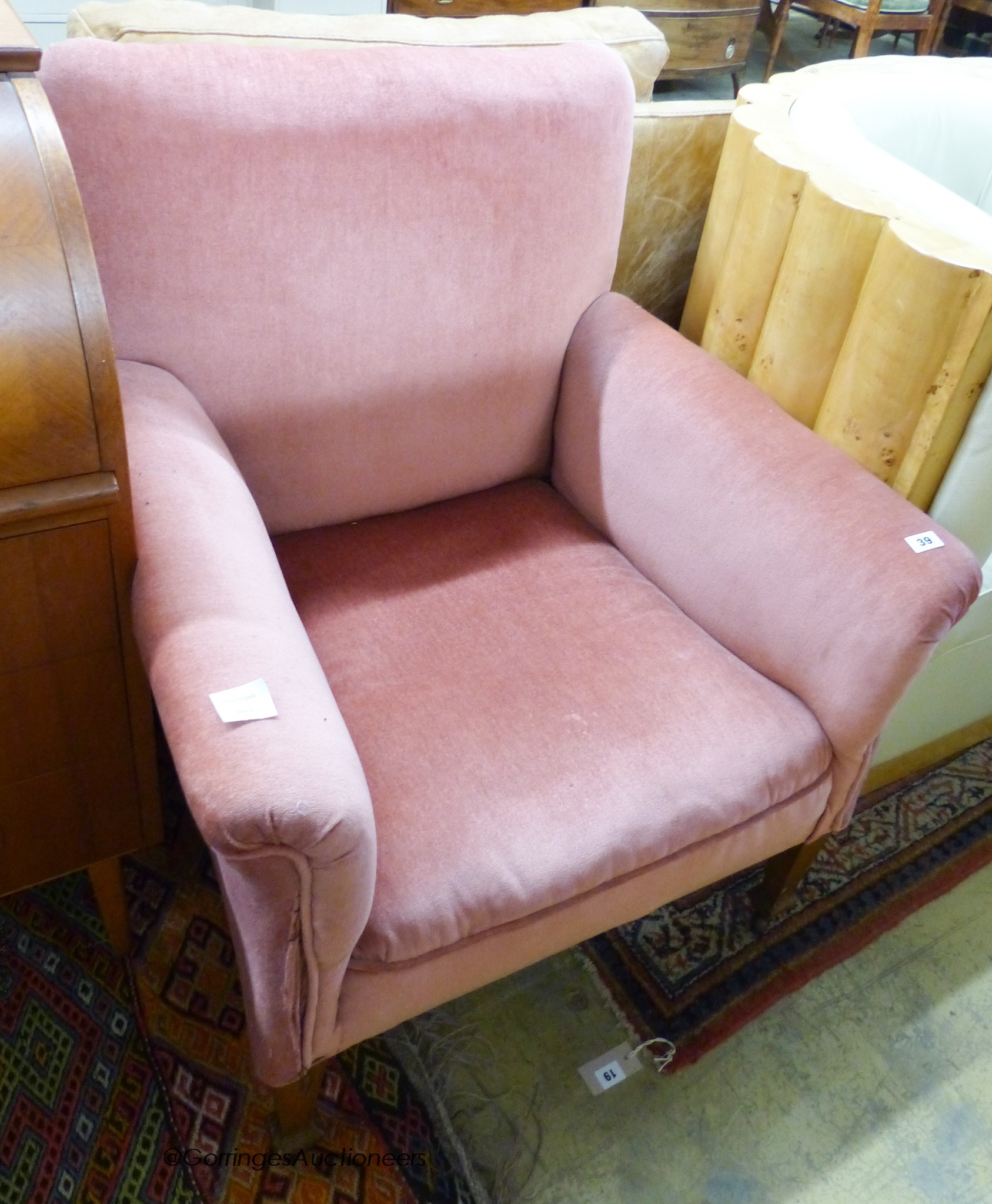 An Edwardian pink upholstered armchair                                                                                                                                                                                      