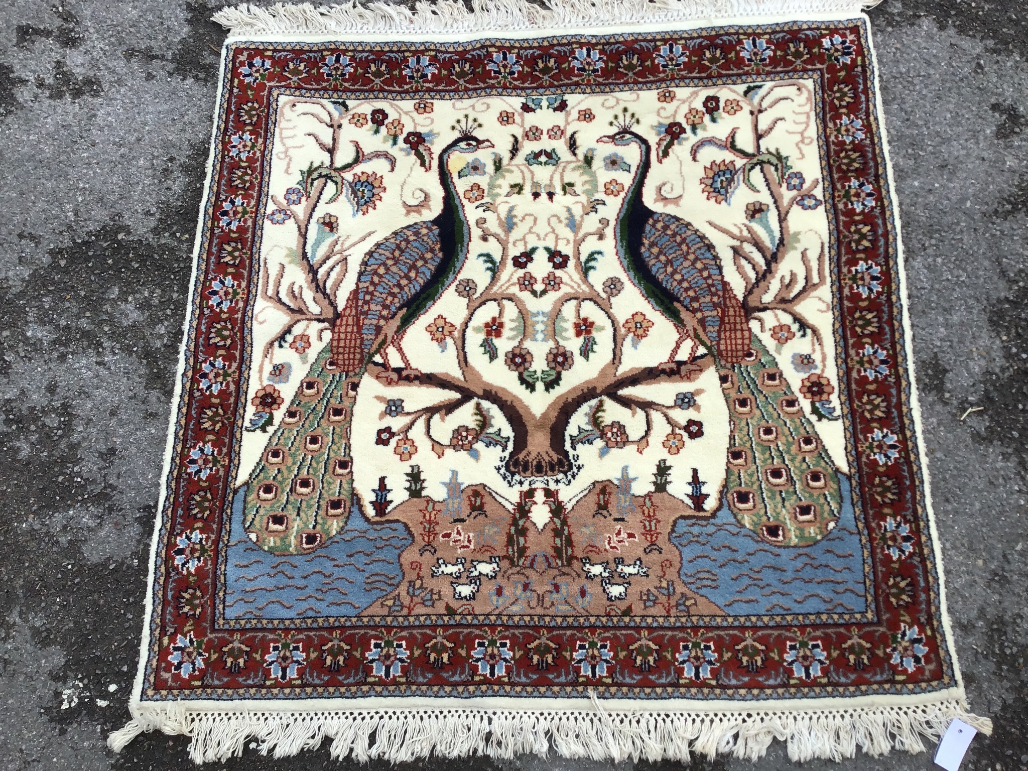 A Tabriz ivory ground 'Peacock' rug, 122 x 120cm                                                                                                                                                                            