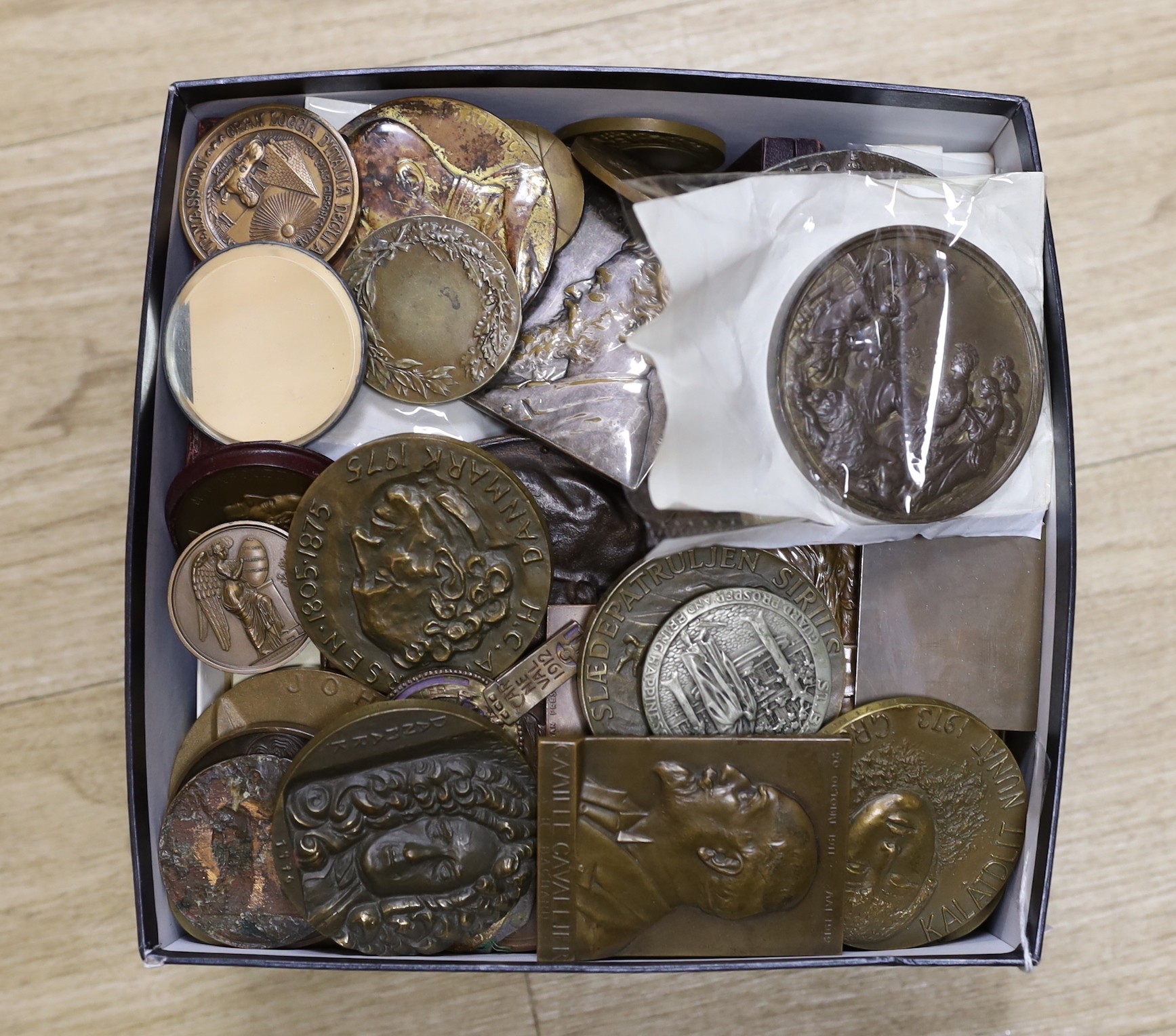 A large and varied collection of mixed cast metal commemorative medallions, mostly European, subjects to include political figures and events, sporting achievements, musical figures, etc, 19th century and later.         