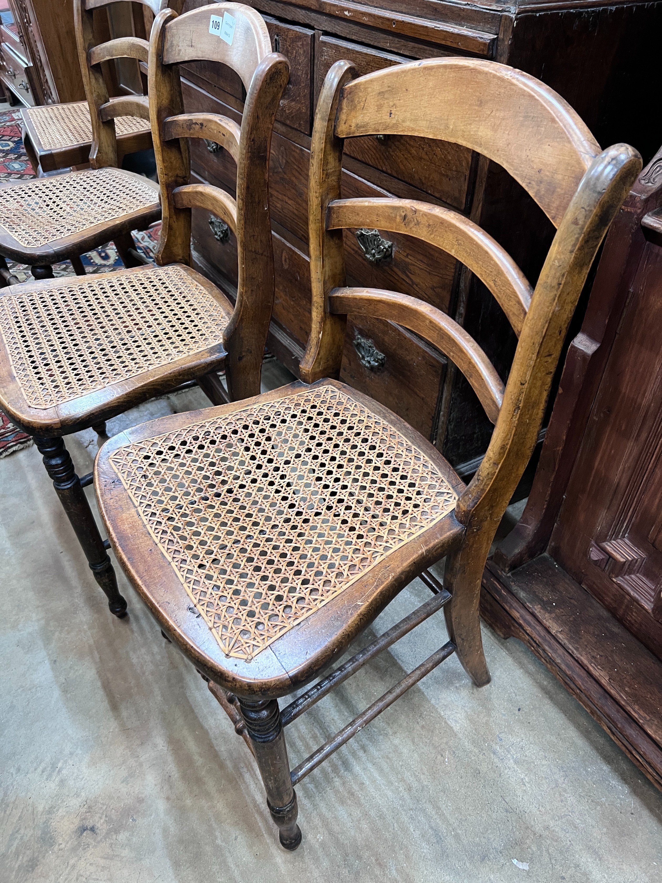 Three Victorian caned beech ladder back dining chairs *Please note the sale commences at 9am.                                                                                                                               