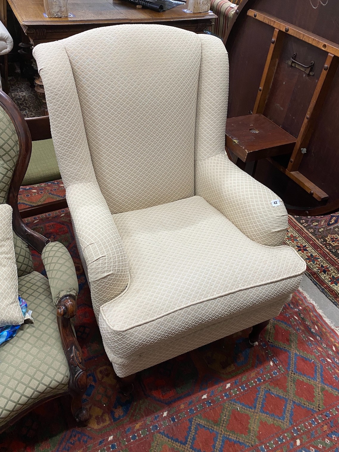 A modern Wesley-Barrell upholstered armchair                                                                                                                                                                                