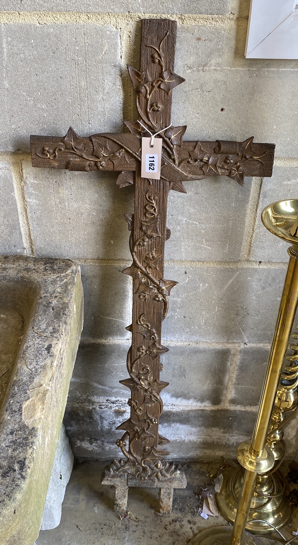 A painted cast iron cross, width 43cm, height 104cm                                                                                                                                                                         