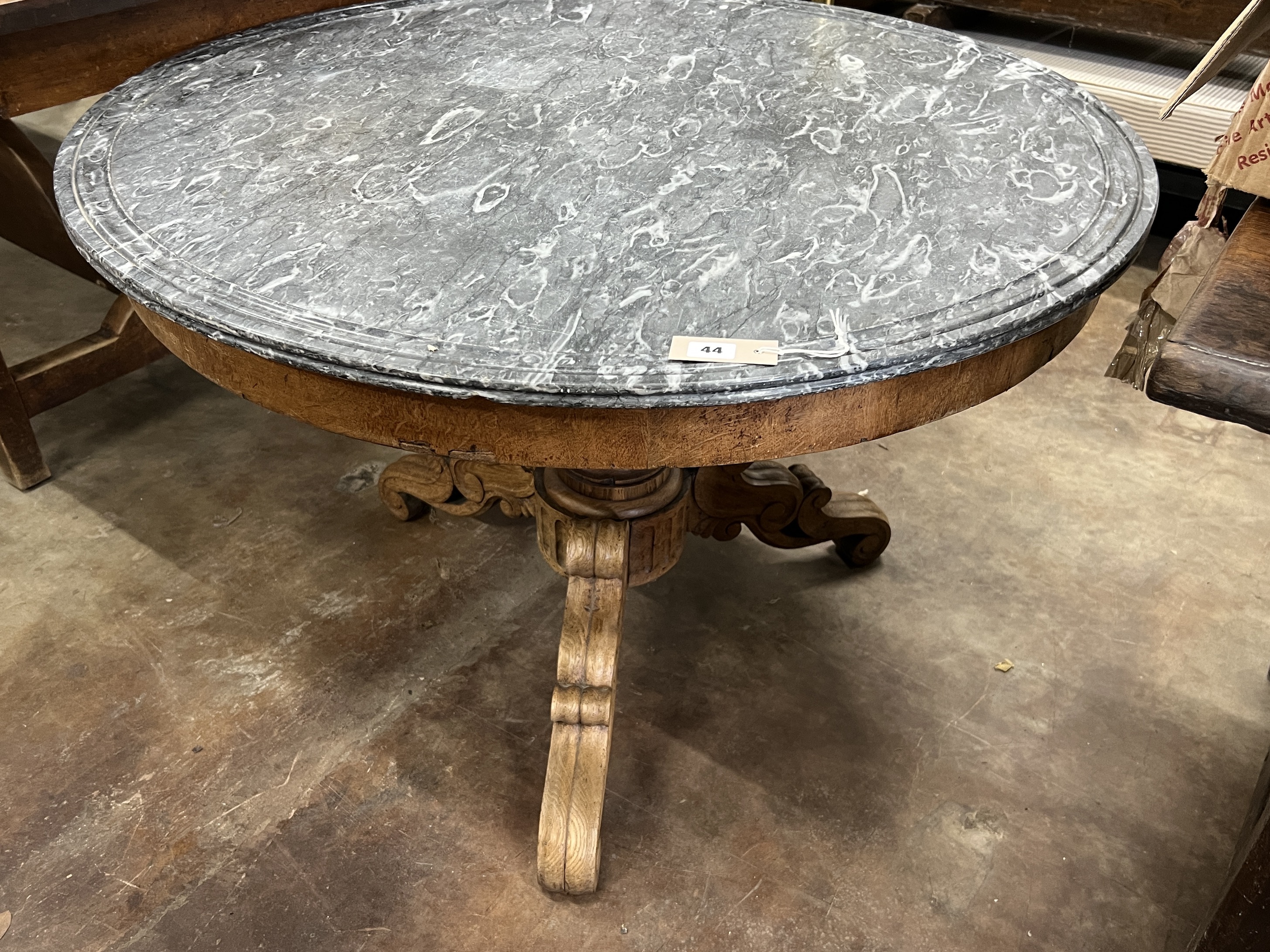 A late 19th century French circular oak marble top centre table, diameter 100cm, height 67cm                                                                                                                                