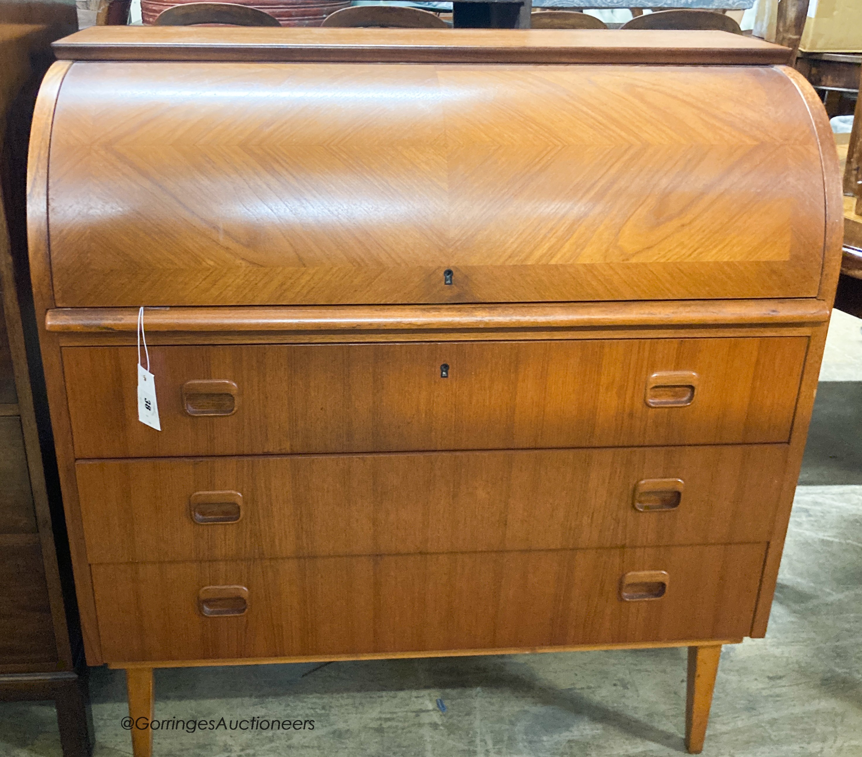 A mid century design teak cylinder bureau, width 90cm, depth 48cm, height 96cm                                                                                                                                              