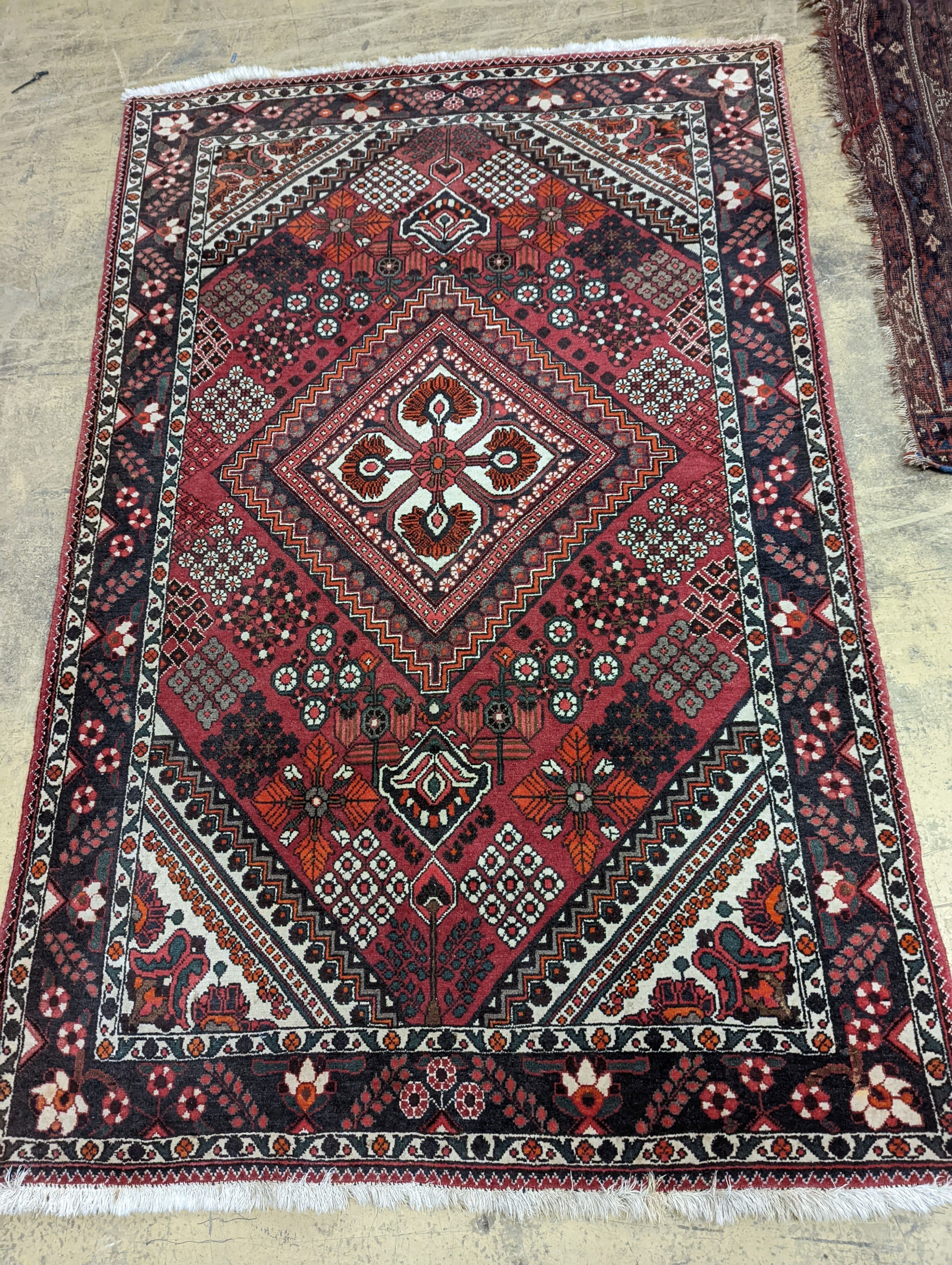 A North West Persian red ground rug, 200 x 130cm                                                                                                                                                                            