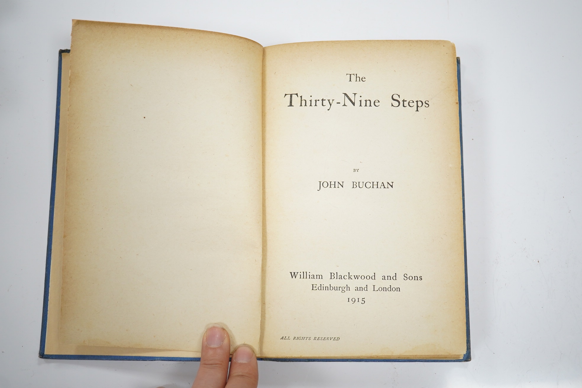 Buchan, John - The Thirty-Nine Steps. 1st Edition. half title and advert. leaf: original blue lettered cloth (rebacked with spine laid-down, though it is completely faded). Edinburgh and London: William Blackwood and Son