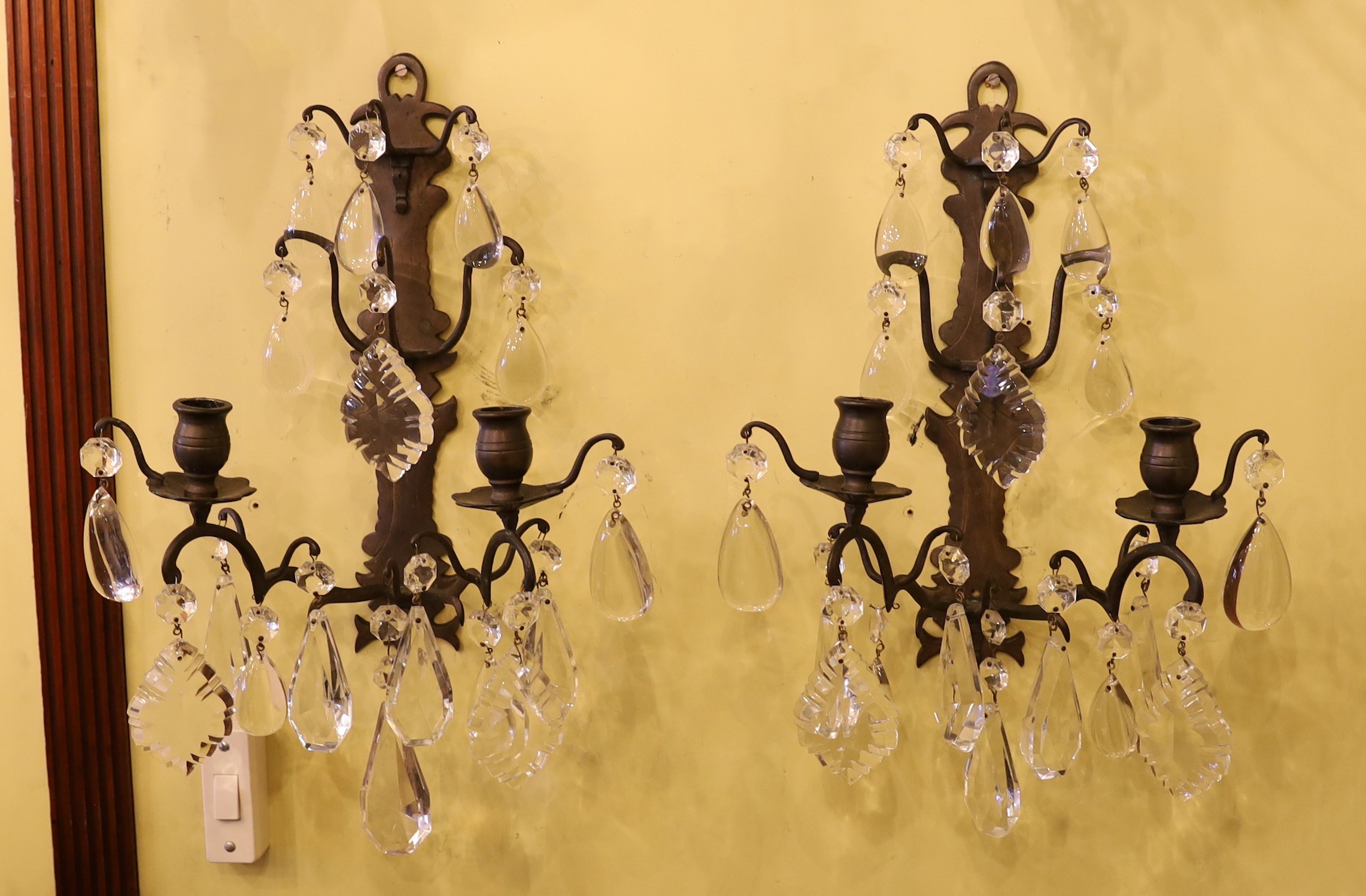 A pair of late 19th century French bronze metal and cut glass twin branch and wall lights, height to the lowest drop 42cm                                                                                                   