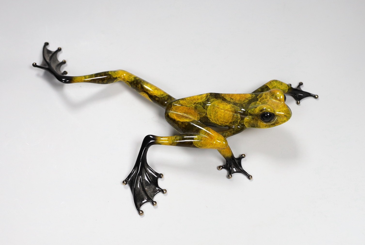 Tim Cotterill (Frogman) a limited edition enamelled bronze frog ‘Hopscotch’ 33/1000 with certificate of authenticity. 28.5cm wide                                                                                           