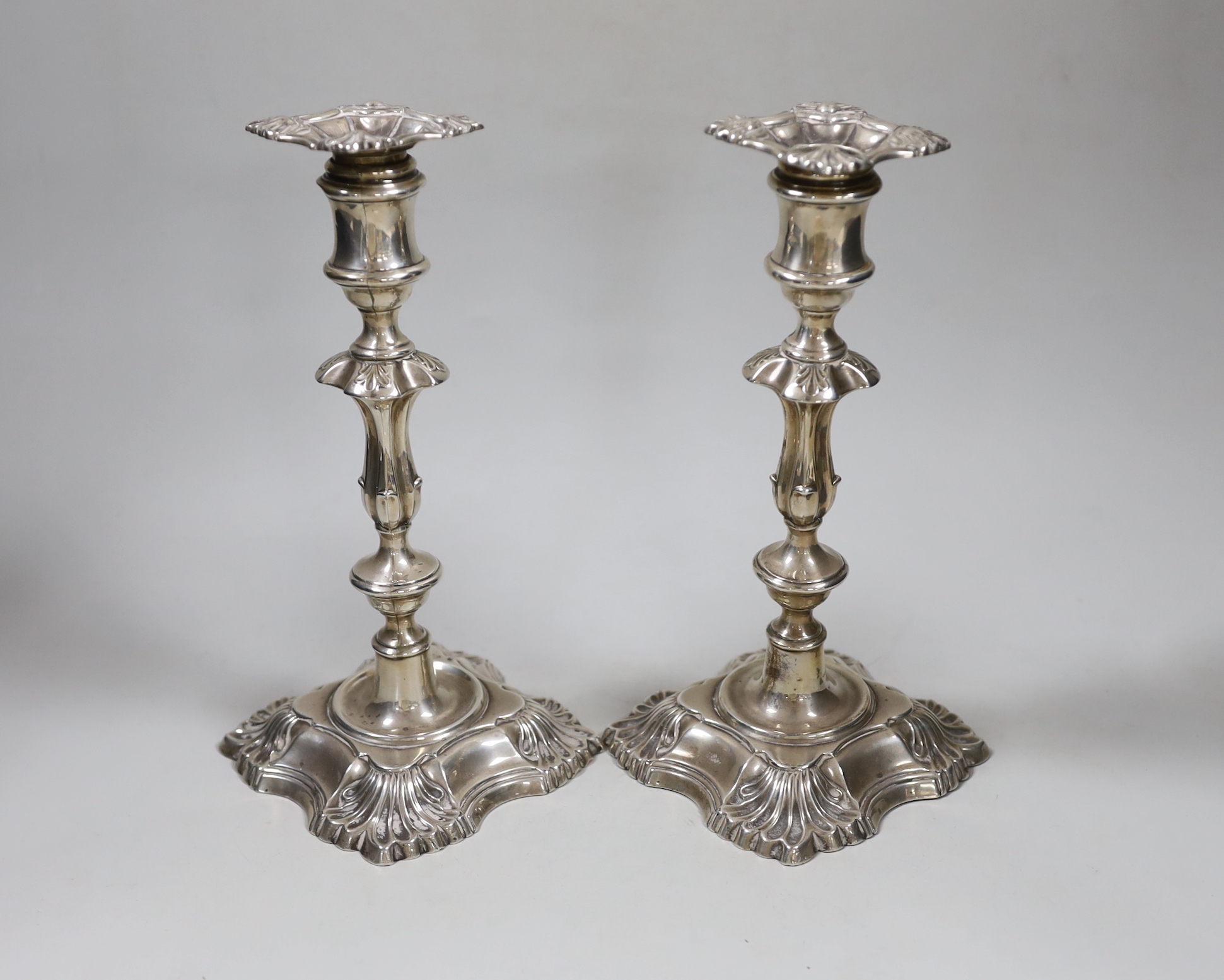 A pair of George V silver mounted candlesticks, with waisted knopped stems, William Hutton & Sons, London, 1910, height 22.7cm, weighted.                                                                                   