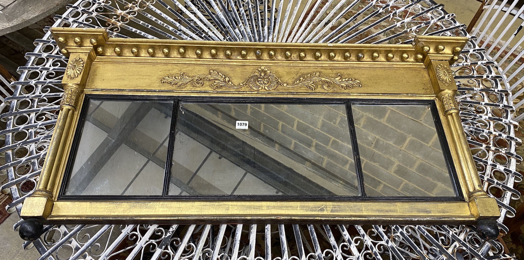 A Regency giltwood and composition overmantel mirror, width 114cm, height 55cm                                                                                                                                              